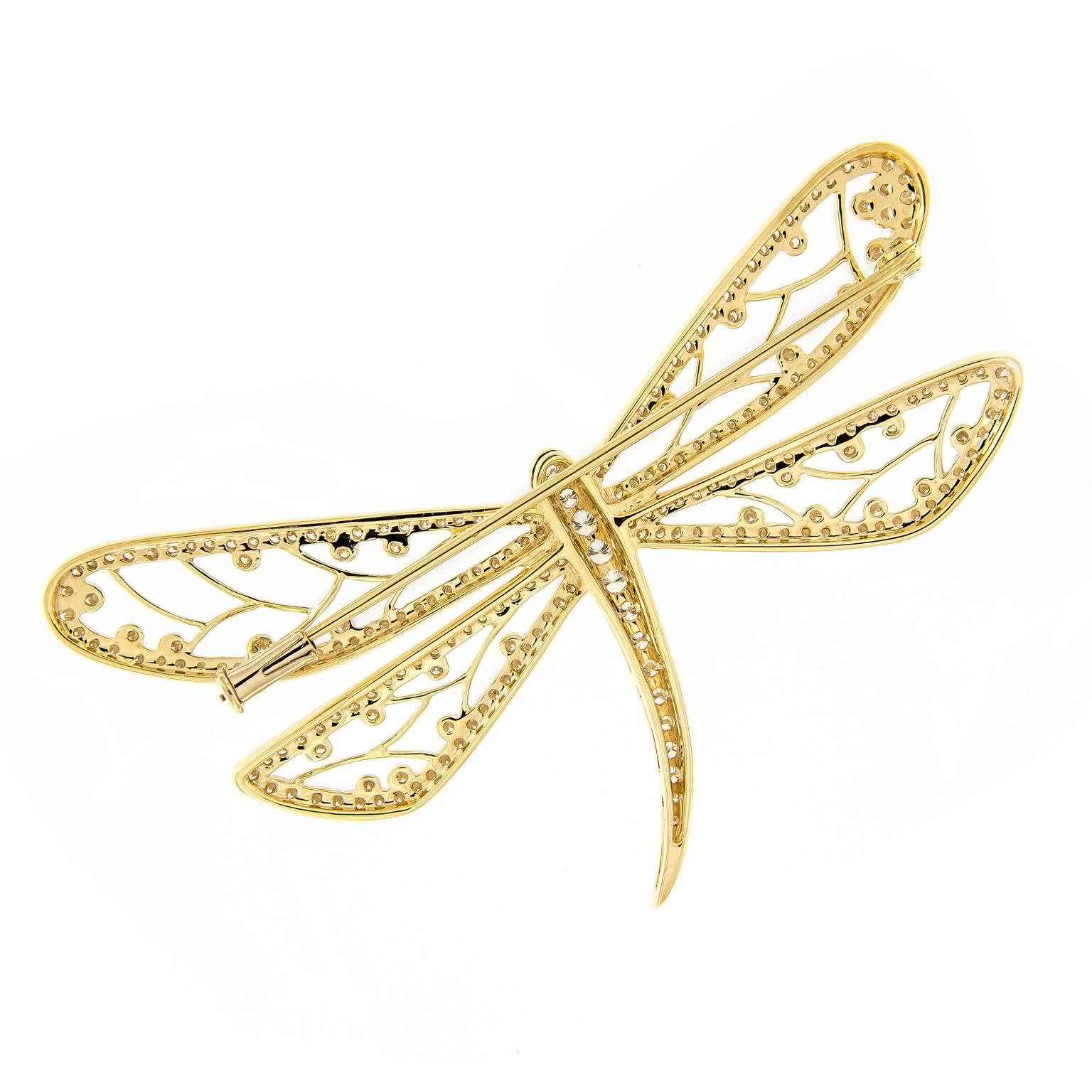 This beautiful dragonfly brooch is crafted in 18k yellow gold. Wings and body feature plenty of diamonds adding lots of sparkle and the open-work design of the wings are beaded polished gold.
2.5 in x 1.5 in (6.35 cm x 3.81 cm)

Diamonds 1.48 cttw