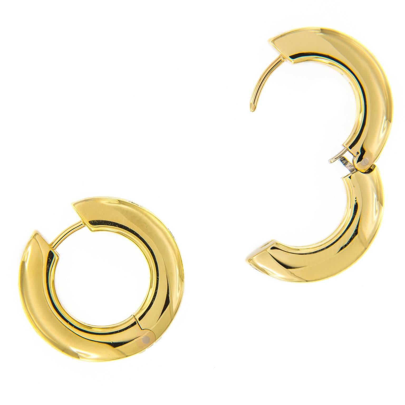 Understated and elegant, these earrings are perfect for a day at the office or an evening out. Showcasing 36 round brilliant cut diamonds and expert craftsmanship in 18k yellow gold with a unique spring hinge. This will be the most comfortable