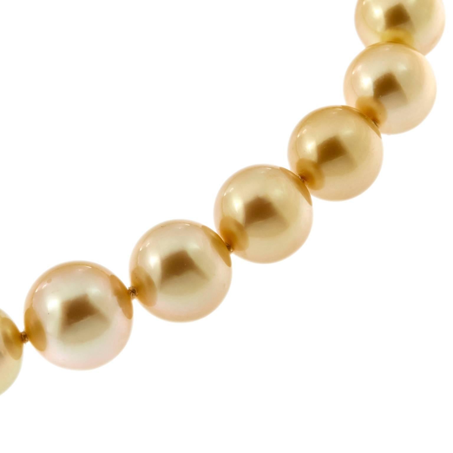 A golden south sea pearl necklace exhibits a beauty and uniqueness that few can compare. Necklace comprised of 39 pearls, 9 -12 mm. Clasp is 14k yellow gold. Weighs 63.3 grams. 17.5 in Long.