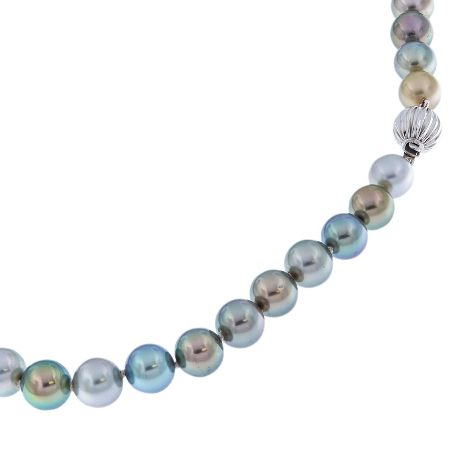 This stunning multi-colored necklace is a splash of irridescent hues. Necklace is comprised of 43 pearls, 9-11.5 mm. Clasp is 14k white gold. Weighs 58.2 grams. 18 in Long.