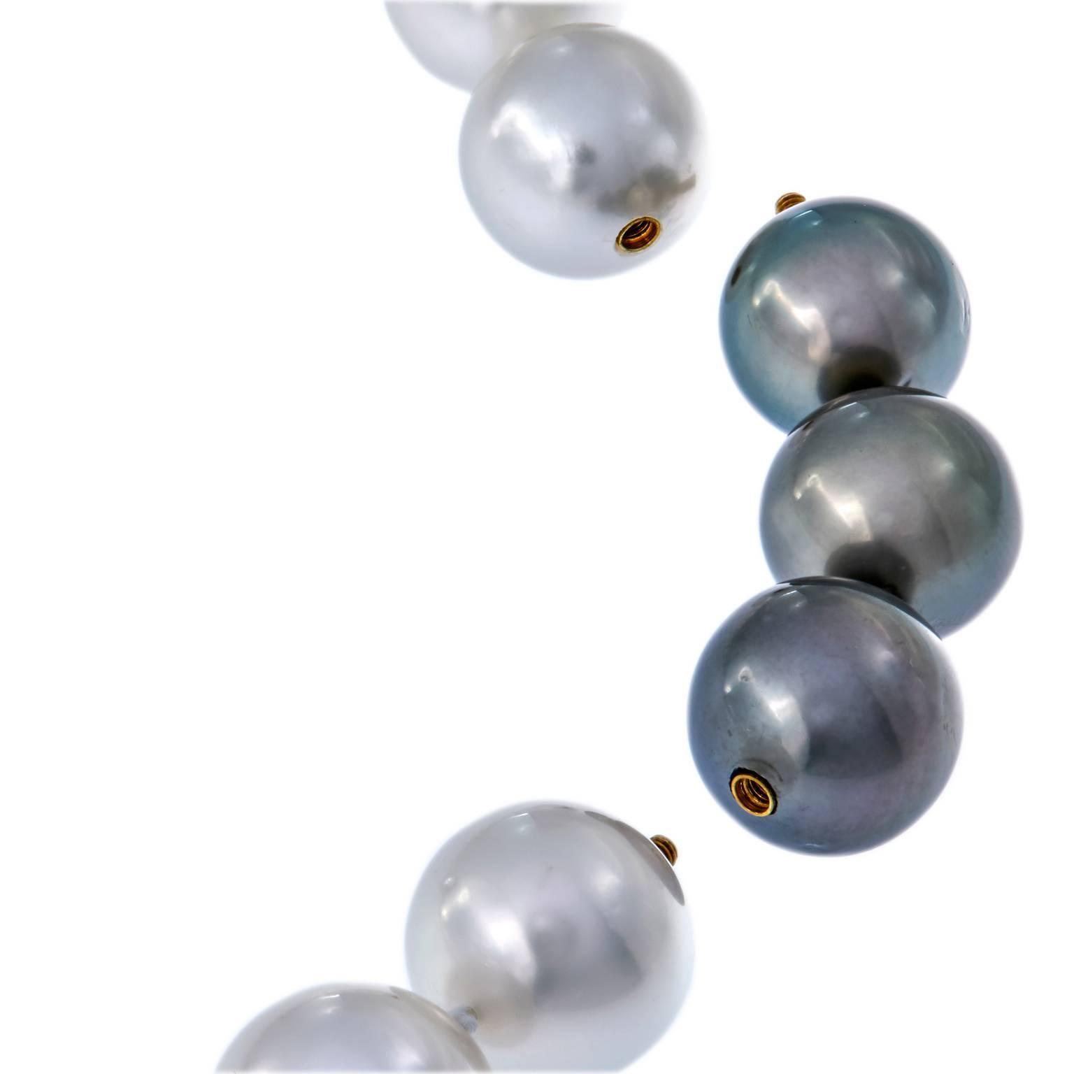 Beautiful south sea white pearls nicely accented with three Tahitian black pearls. Necklace is comprised of 36 pearls, 12 - 14 mm. Black pearls can be removed for an all white pearl necklace. 19.5 in Long with black pearl extension. Clasp is 14k