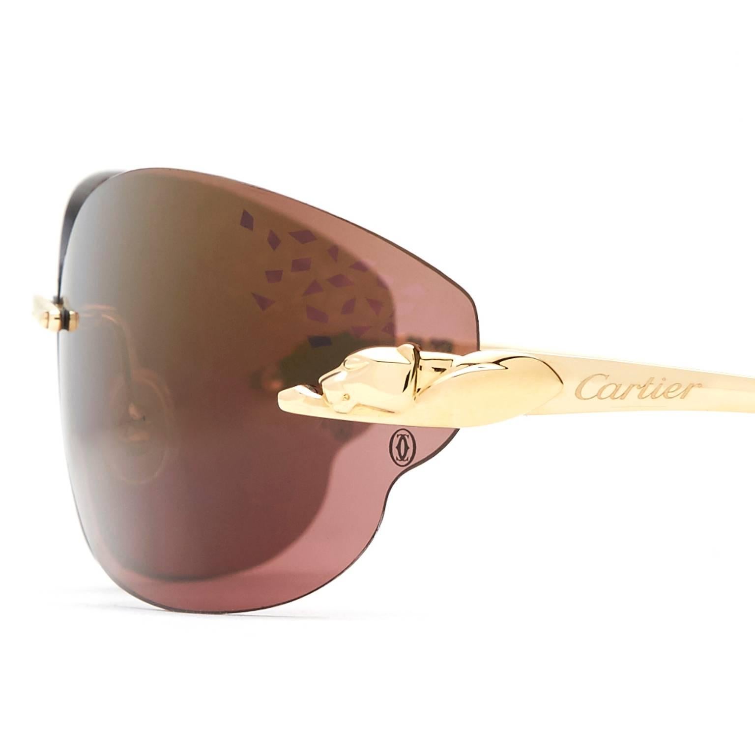 Cartier Panther rimless woman sunglasses. They are embellished with signature yellow gold-tone finished panthers at the hinges.