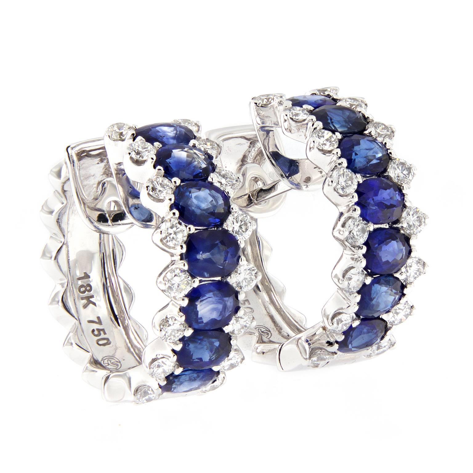 A beautiful combination of oval sapphires and diamonds create a stunning hoop earring. Earrings are crafted in 18k white gold. Weigh 12.2 grams.

Sapphires 4.43 cttw
Diamonds 1.12 cttw