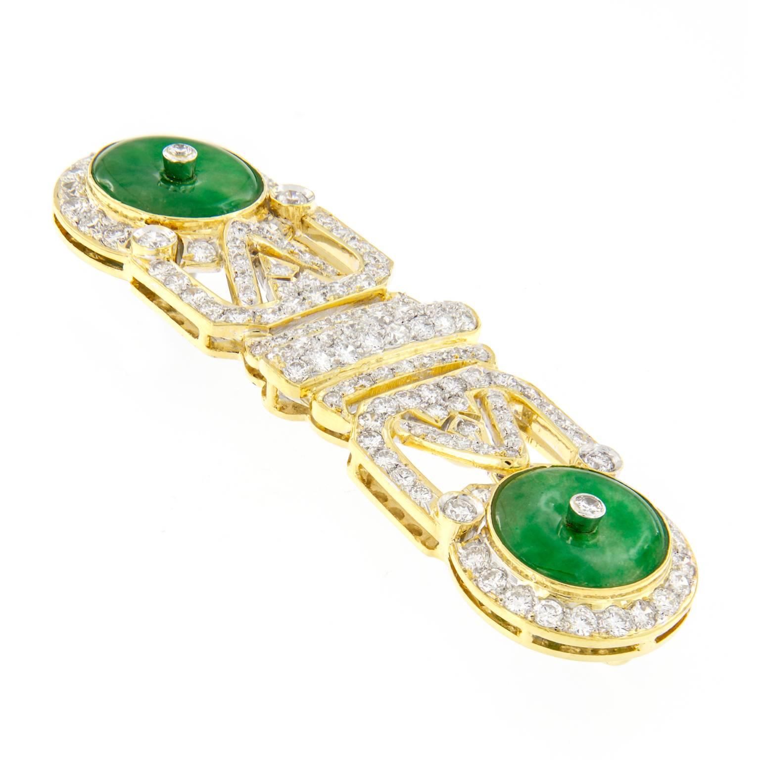The openwork stylized design crafted in 18k yellow gold features two beautiful apple green semi-transperent jadeite Jade disks with diamond centers. Beautiful Art Deco style pin can also be worn as a pendant!

2