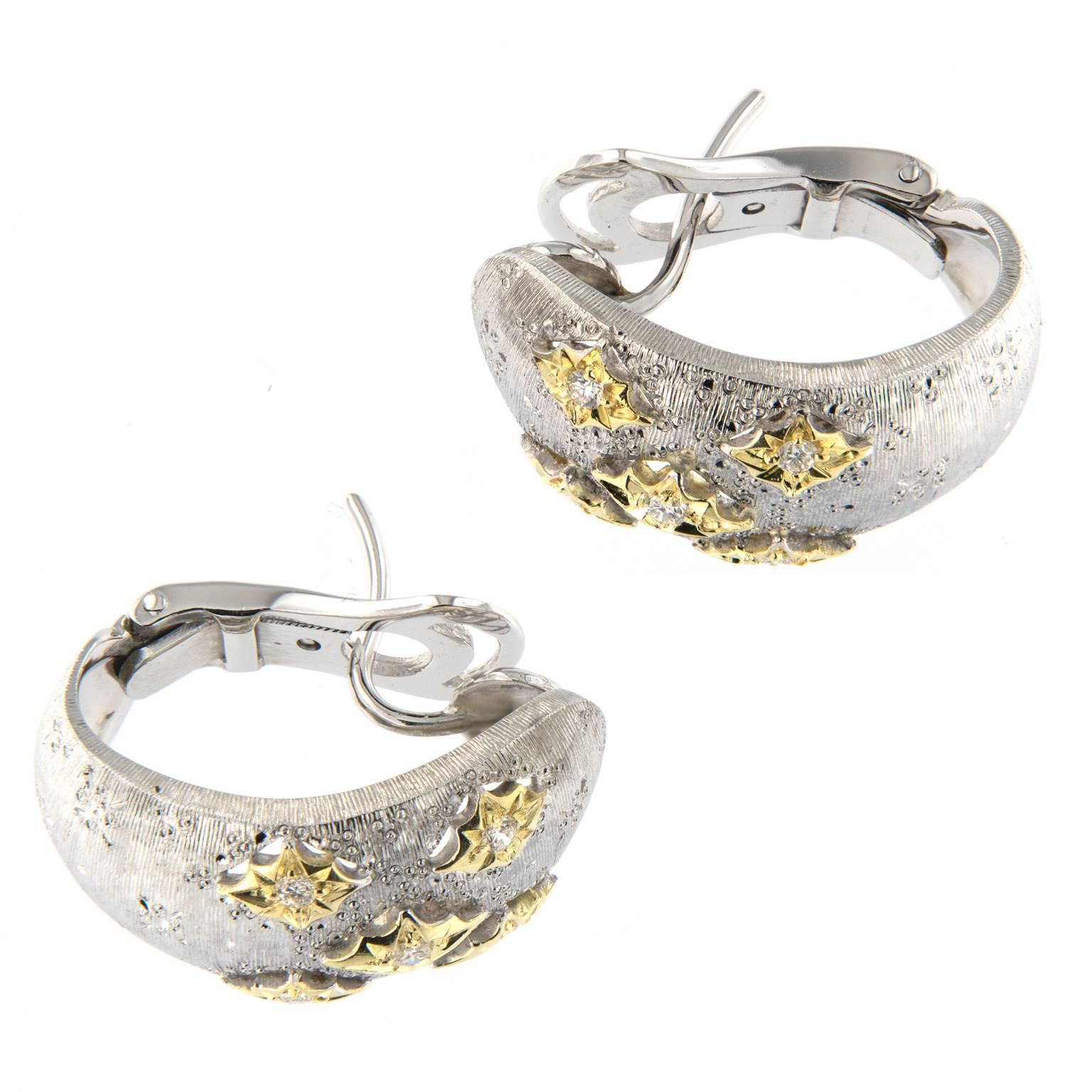 18k yellow and white gold wide hoop earrings accented with diamonds. Earrings are inspired by the classic Buccellati design featuring textured gold made to look like fine fabric. Weighs 12.8 grams

Diamonds 0.17 cttw
Marked Italy