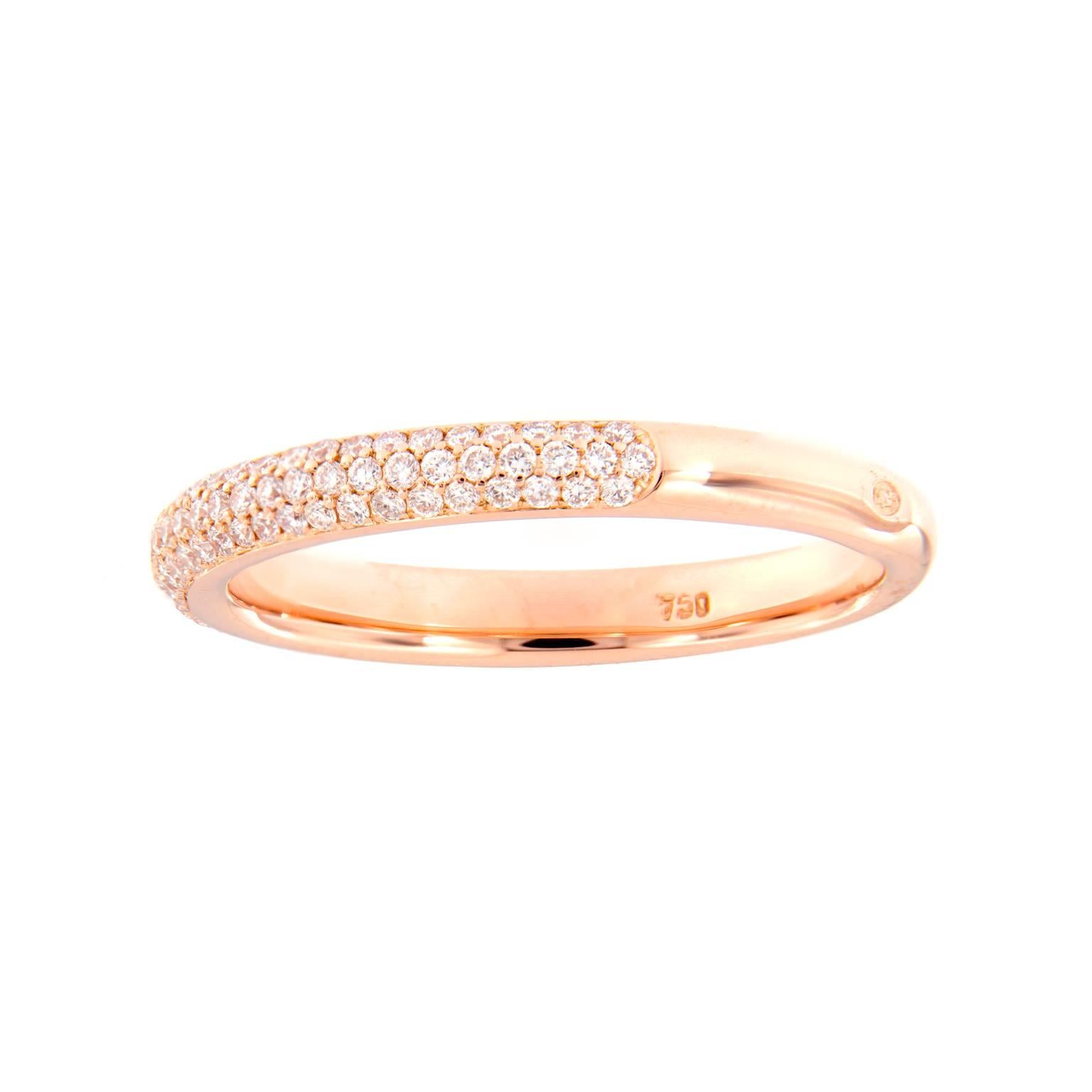 This delicately crafted 18k rose gold wedding anniversary band ring features three rows of pavé set diamonds that weigh a total of 0.58 cttw. 
Ring size 6. Weighs 3.1 grams. 

Diamond 0.58 cttw