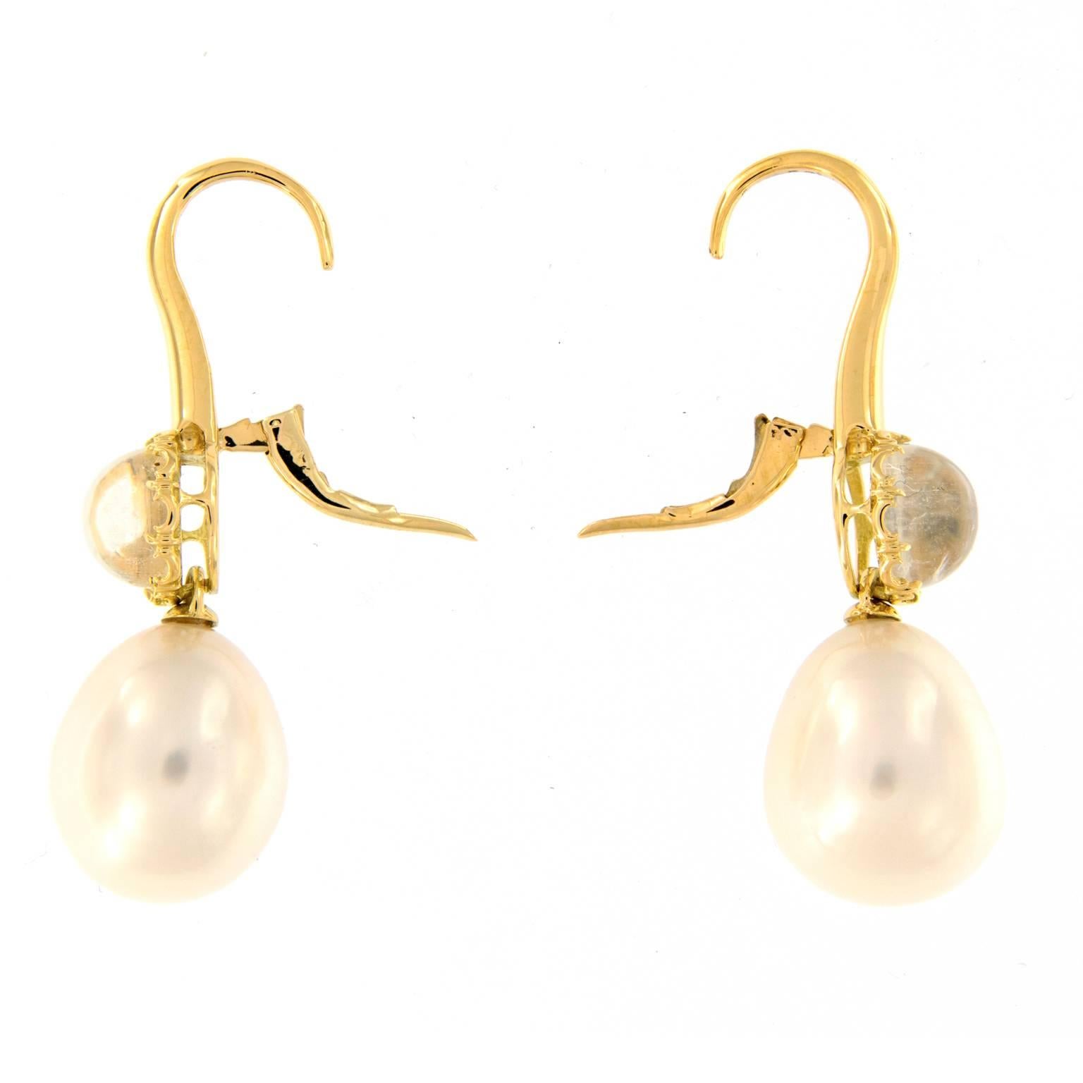 Lovely drop earrings from Assael feature a South Sea pearl that drops from a moonstone set in 18k yellow gold. Pearls 15.3 mm x 12.8 mm. Weigh 11.6 grams.

Moonstone 4.65 ct
