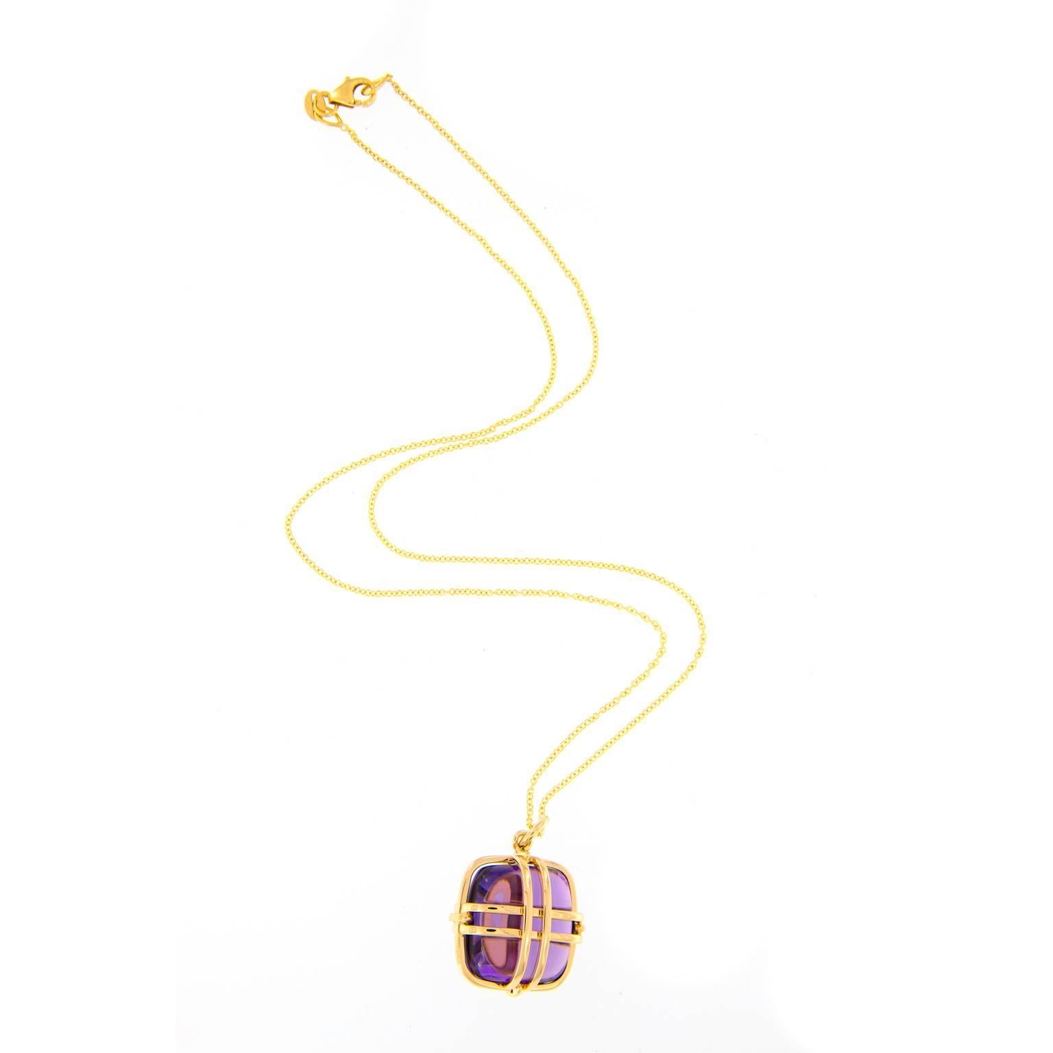 Beautiful amethyst in a fun cube shape surrounded by an intricate cage pattern of 18k yellow gold. Pendant drops from an 18 inch chain. From the Freedom Collection designed by Goshwara. Weighs 9.0 grams. Pendant is 14.33 mm x 14.33 mm.

Amethyst