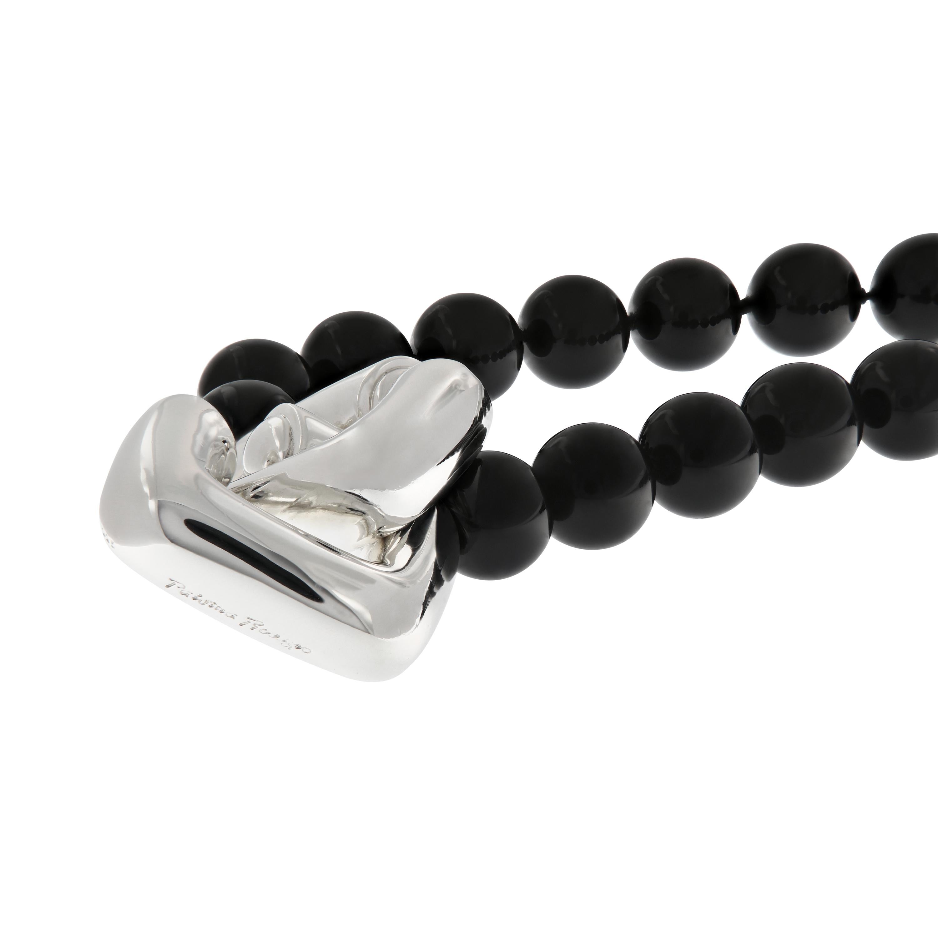 This necklace is crafted of beautifully polished spheres of black onyx with a large sterling silver two ring clasp. The necklace is 31 inches long. This estate piece is gently worn and comes with the original box and pouch. Weighs 179.1