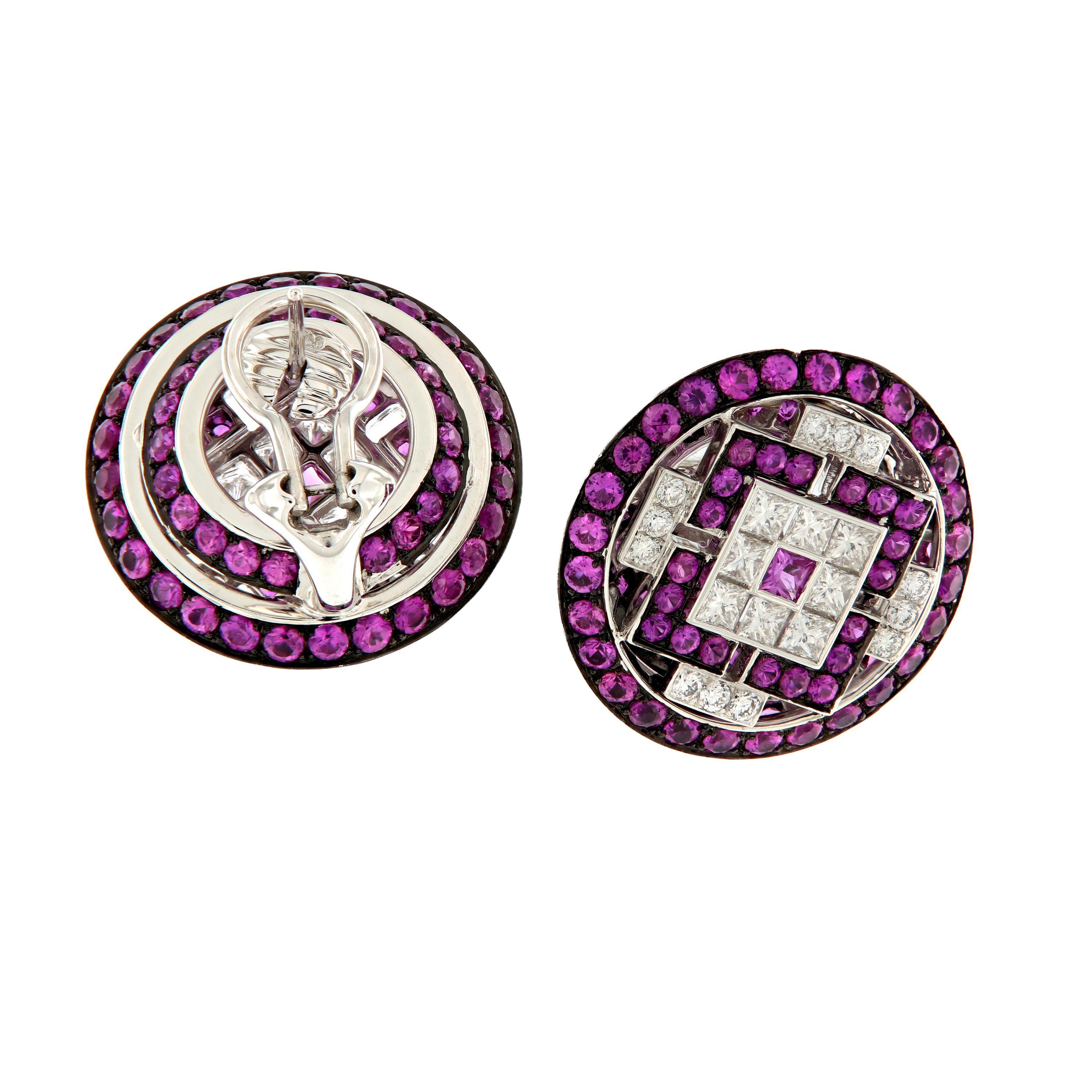 Stunning earrings of pink sapphires and diamonds set in a geometric design, finished with black rhodium plating over 18 karat white gold. Weigh 18.3 grams. 22mm in diameter.

Pink Sapphires 8.21 cttw
Diamonds 1.78 cttw