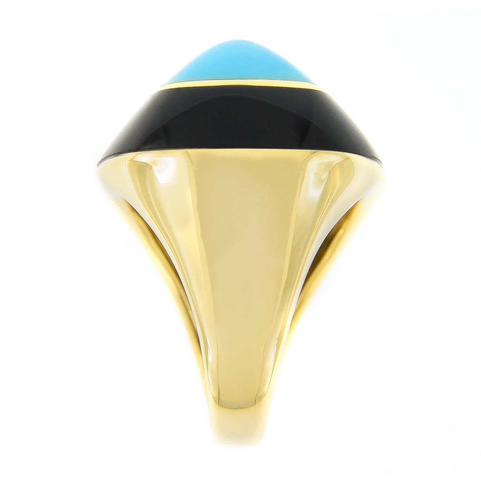 Make a bold statement with this fabulous 18k yellow gold ring made for Campanelli & Pear by Molina. Retro in style, this pyramidal ring features a Persian Turquoise center stone surrounded by a band of black onyx.

Hallmarked Italy

Size 6; ring can