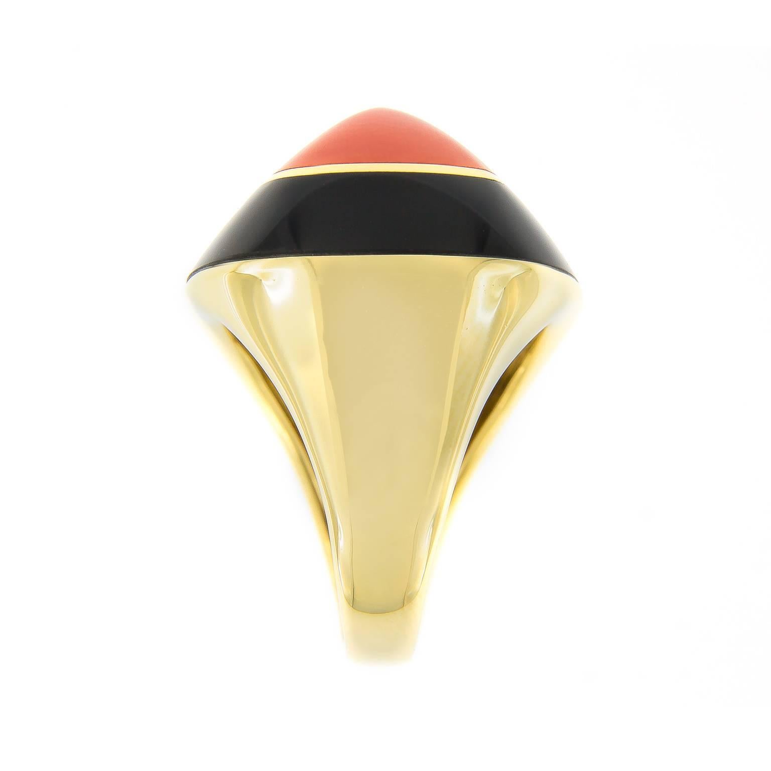 Make a bold statement with this fabulous 18k yellow gold ring made for Campanelli & Pear by Molina. Retro in style, this pyramidal ring features a fine Mediterranean coral center stone surrounded by a band of black onyx.

Hallmarked Italy

Size 6;