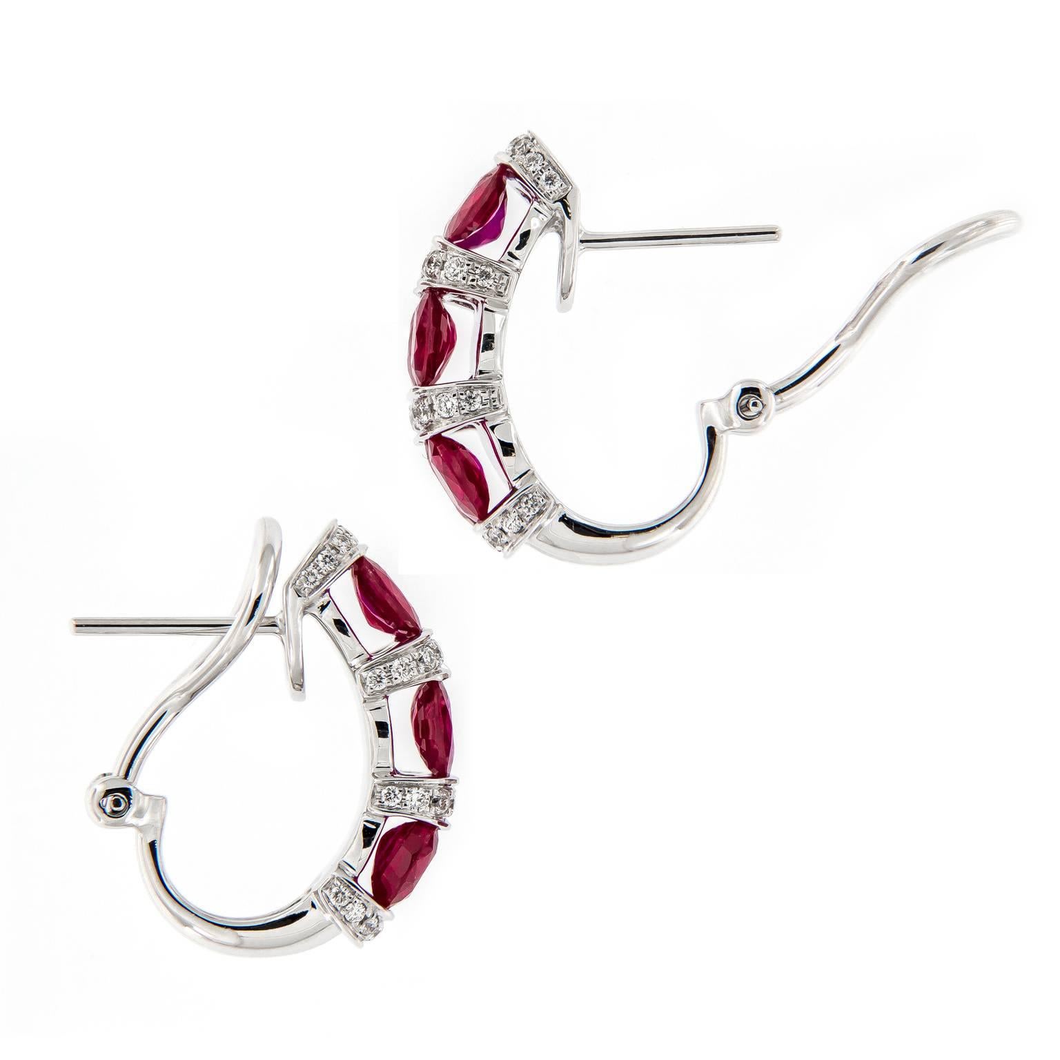 Alternate rows of contrasting mixture of oval rubies and pave set diamonds create a stunning look. Earrings are crafted in 18k white gold with Omega backs.

Rubies 4.51 cttw
Diamonds 0.50 cttw