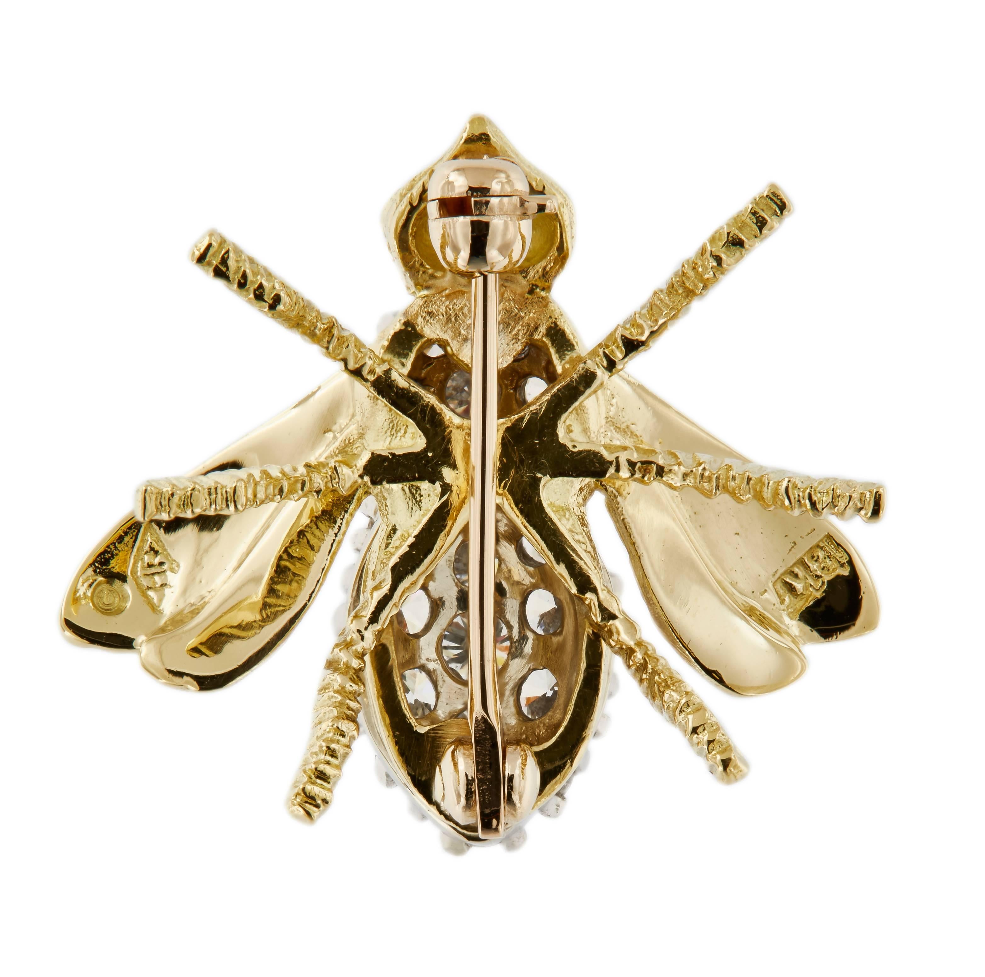 Charming stylized Herbert Rosenthal bee pin is compromised of 18k yellow gold with a diamond encrusted body and ruby eyes. Weighs 5.9 grams.

Marked Herbert Rosenthal
Diamond 0.85 cttw