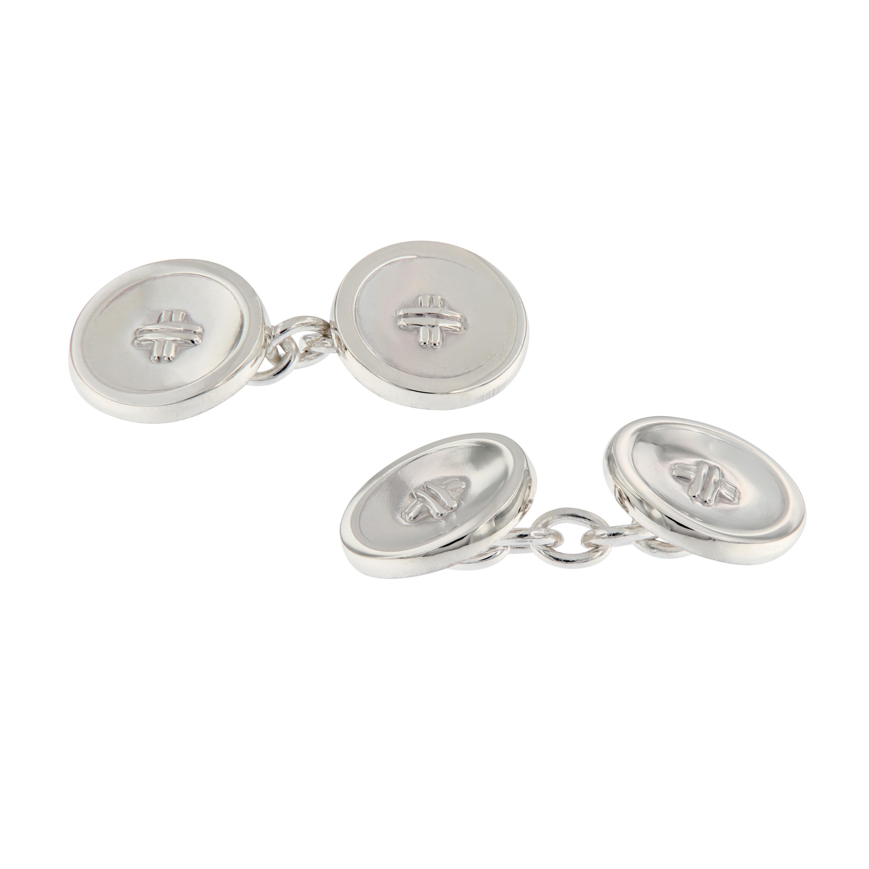 Polished sterling silver double round cufflinks with chain fastenings. The discs are 14mm diameter in size. Weigh 13.1 grams.