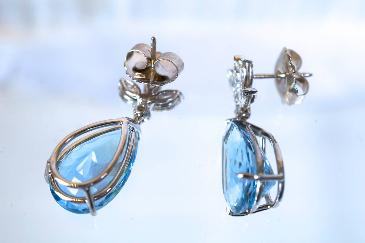 Summer is here!!
Beautiful Deep Warm Blue color Aquamarine & Diamond ear - pendant! 
The top is a 3 impressive marque shape diamonds connected with a single brilliant shape diamond with the dangling pear shape aquamarine.
The total weight of