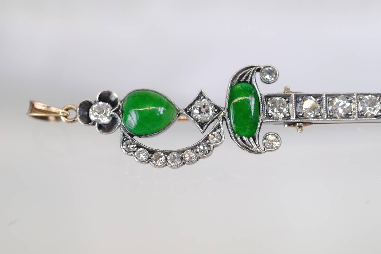 Art Deco Diamond and Jade brooch!
The sword shape brooch/pendant has 21 brilliant shape diamonds with approximate weight of 1.50 carat. Two vibrant color jades, one oval and one pear shape.
Yellow and Rose Gold