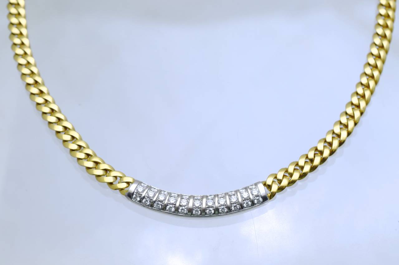 Elegant diamond necklace by Fred Paris.
18 k gold link chain with 33 diamonds set in a gold bar design in the center.
The length of the necklace is 16 inches
Estimated total weight of the diamonds is 1.45 carats
Makers hallmark on the lock
