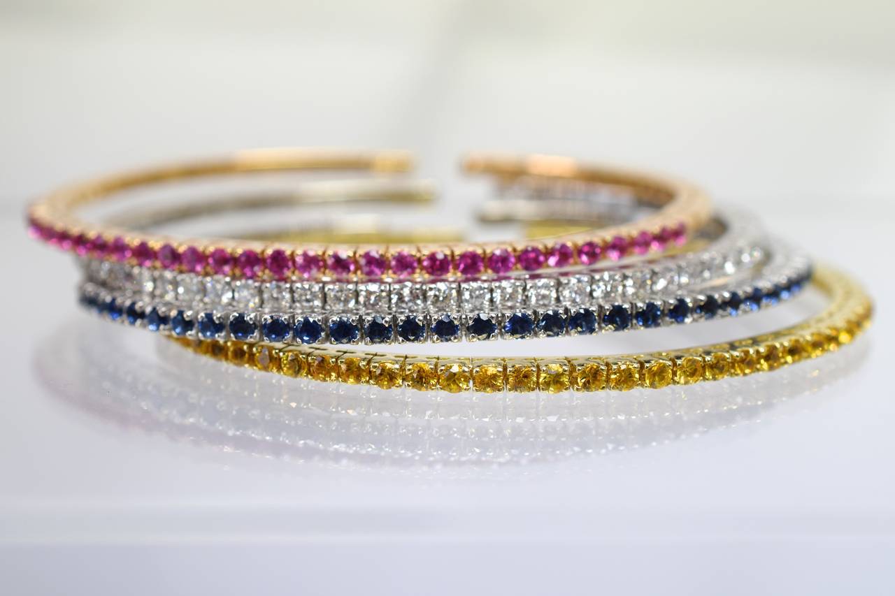 Colorful! 

Set of 4 flexible bangle bracelets-diamond, yellow, blue and  pink sapphire set in 18k white, pink and yellow gold. Can be worn for different occasions as single, double triple or all for together with alternative color
