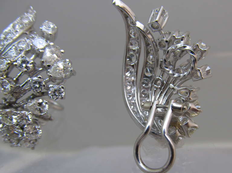 Impressive!
Art Deco diamond ear clips, spray design with brilliant & pear shape diamonds set in platinum
Estimated total weight of the diamonds is 8 carats
