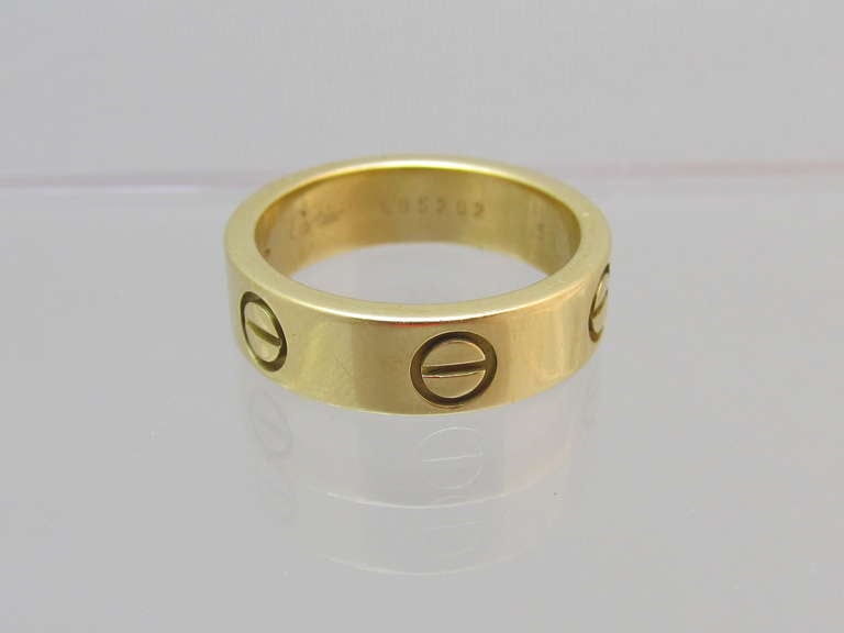Cartier!
Love band in 18k yellow gold
Cartier: # E95292

Size: 53 (6.5)