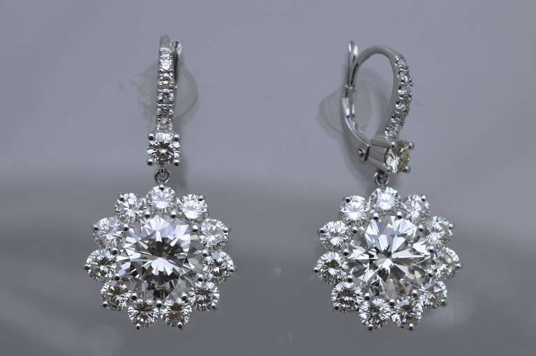 Timeless elegance!
Floral design diamond drop earrings.
Center diamonds are 
3.05ct  J color VS1 clarity 
E.G.L. USA Certified Rep. #US67749601 
3.00 ct  J color VS2 clarity
E.G.L. USA Certified Rep. #US64576201D
36 surround diamonds are 4.10