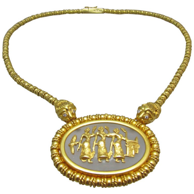 Elias Lalaounis gold collar necklace! 
Two lions with diamond eyes  holding the center golden cased  crystal with  three Ancient Greek dancers depicted in crystal 
Illias Lalaounis (Lalaounis Hallmark) 750 A.21