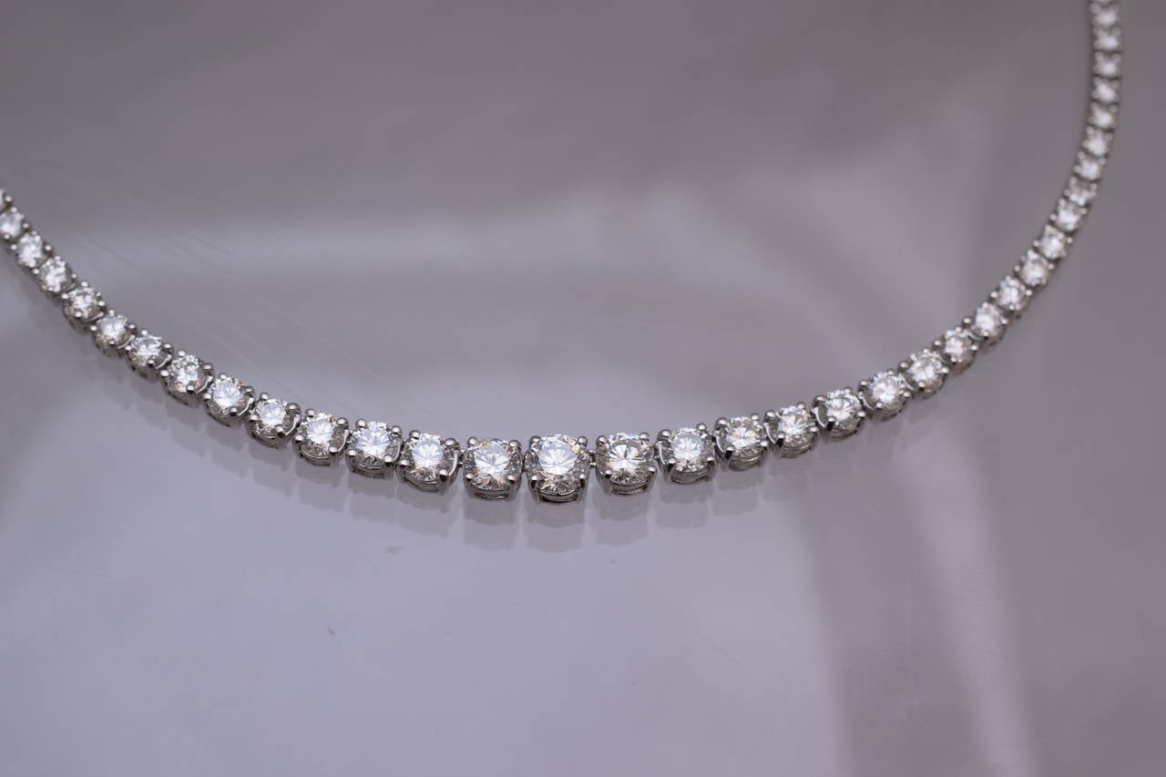 Timeless!

Diamond Riviere necklace, gradual brilliant shape diamonds set in 18k white gold.

3 center diamonds are
 1.05ct G color VVS2 clarity  G.I.A. certified
 0.79ct G color  SI1   clarity   G.I.A. certified
 0.80ct H color  VS2 clarity 