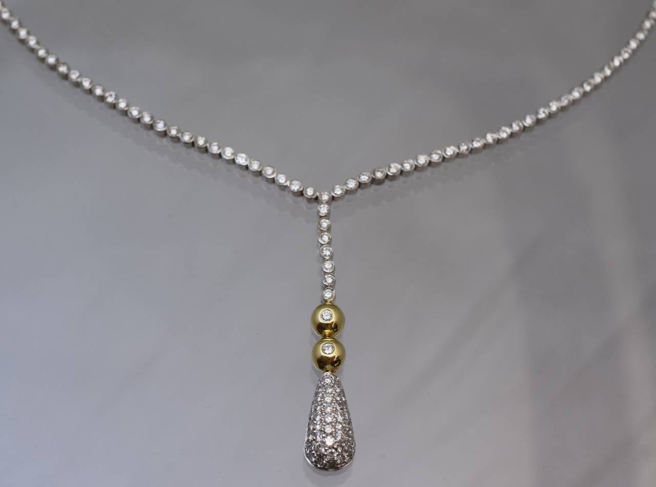 Beautiful & elegant  diamond lariat.
Front part of the necklace is a white gold  with bezel style set diamonds  with a pave set diamond drop.
Estimated total weight of diamonds is 3,50 carats
18k white & yellow gold
Length of the necklace is 15