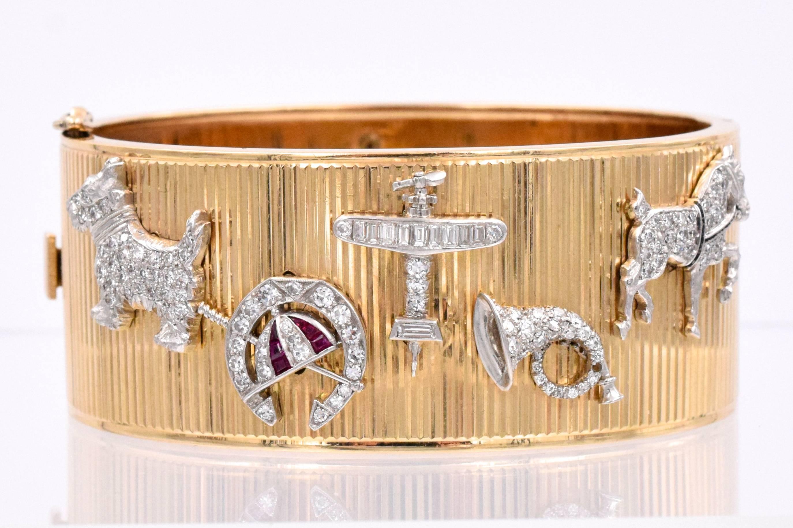 Adorable diamond charm cuff bracelet with 11 affixed platinum gems with various  designs. The bracelet is 14 k yellow gold with ribbed design with 11  Art Deco charms is platinum,  a key, a rooster a wreath, a  clover, a cowboy A a horse, a