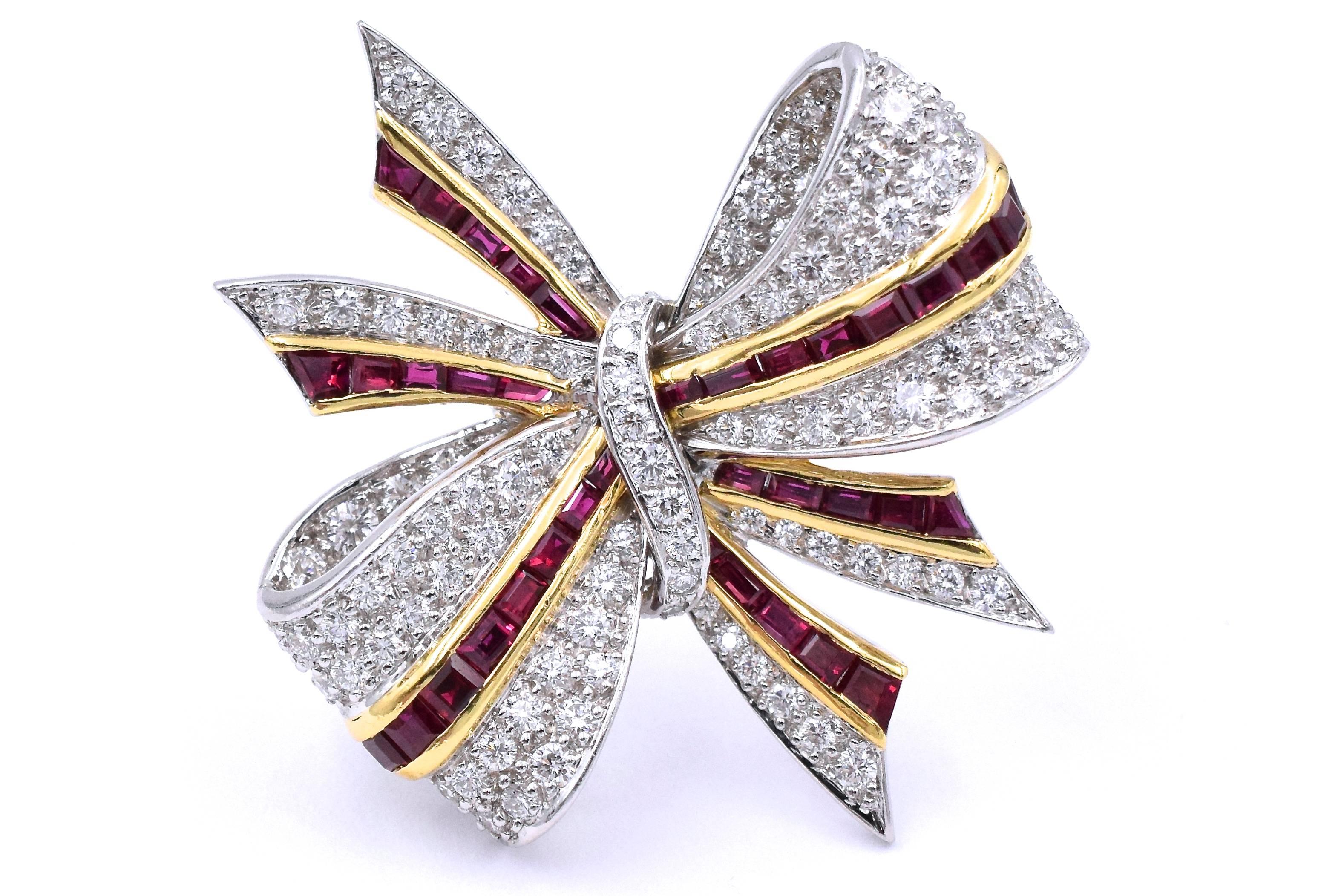 Tiffany & Co diamond and  ruby and diamond bow brooch!
38 square faceted rubies set in 18k yellow gold, weighing 1.45 carats
116 brilliant diamonds set in platinum, weighing 1.37carats
Signed: Tiffany and Co