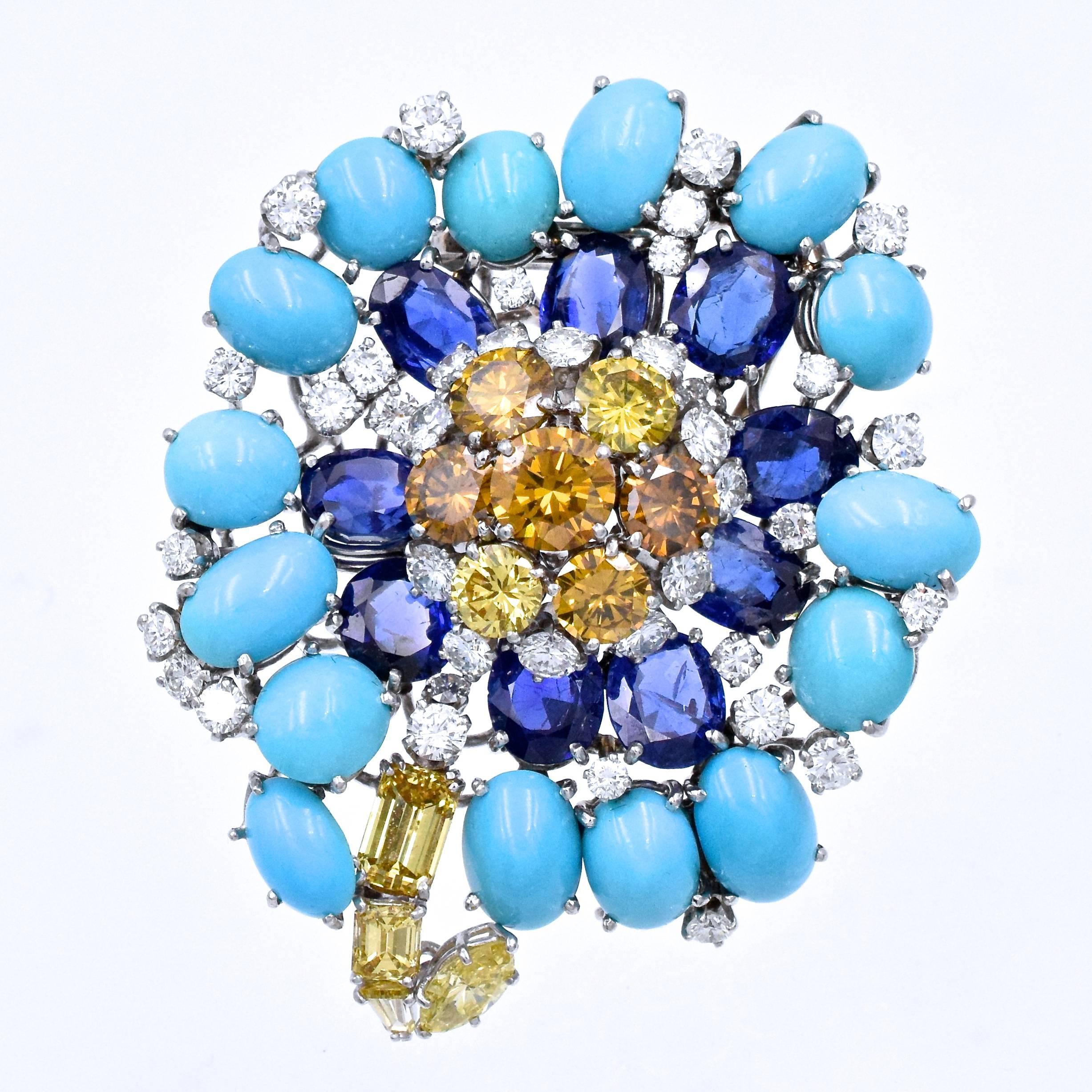 Bold look of David Webb colorful brooch!
Flower, diamond, sapphire and turquoise pin by David Webb.
Yellow diamonds approximately 7ct, white diamonds approximately 2.5ct, sapphires approximately 15ct
 Platinum & measurements are  1.5 x 2.25