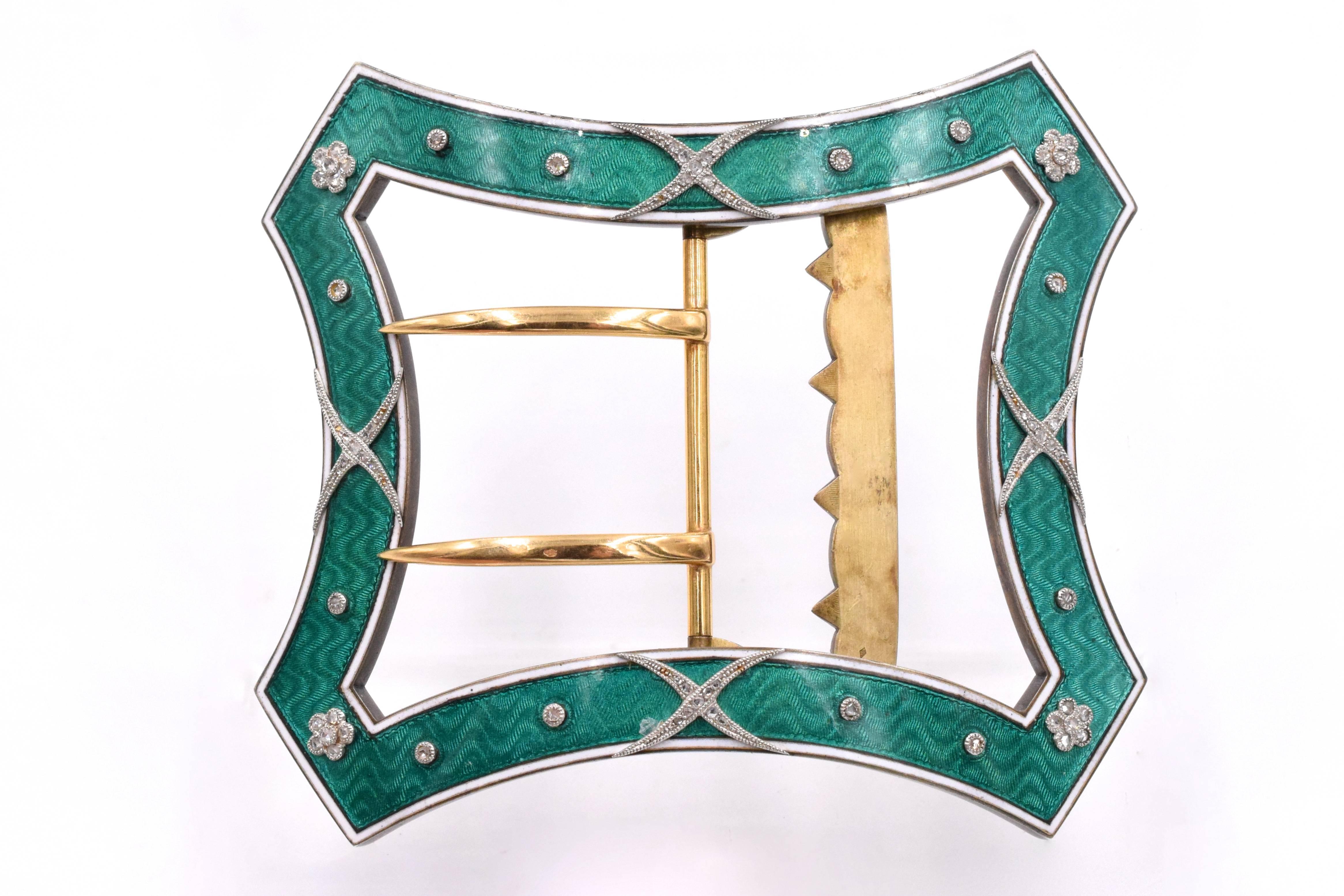 Cartier enamel and diamond belt buckle. French
 The domed rectangular buckle decorated with green guilloché enamel and white enamel borders, set with rose-cut diamond flower-head, cross-shaped and collet accents, 9.0 cm, with French marks for gold