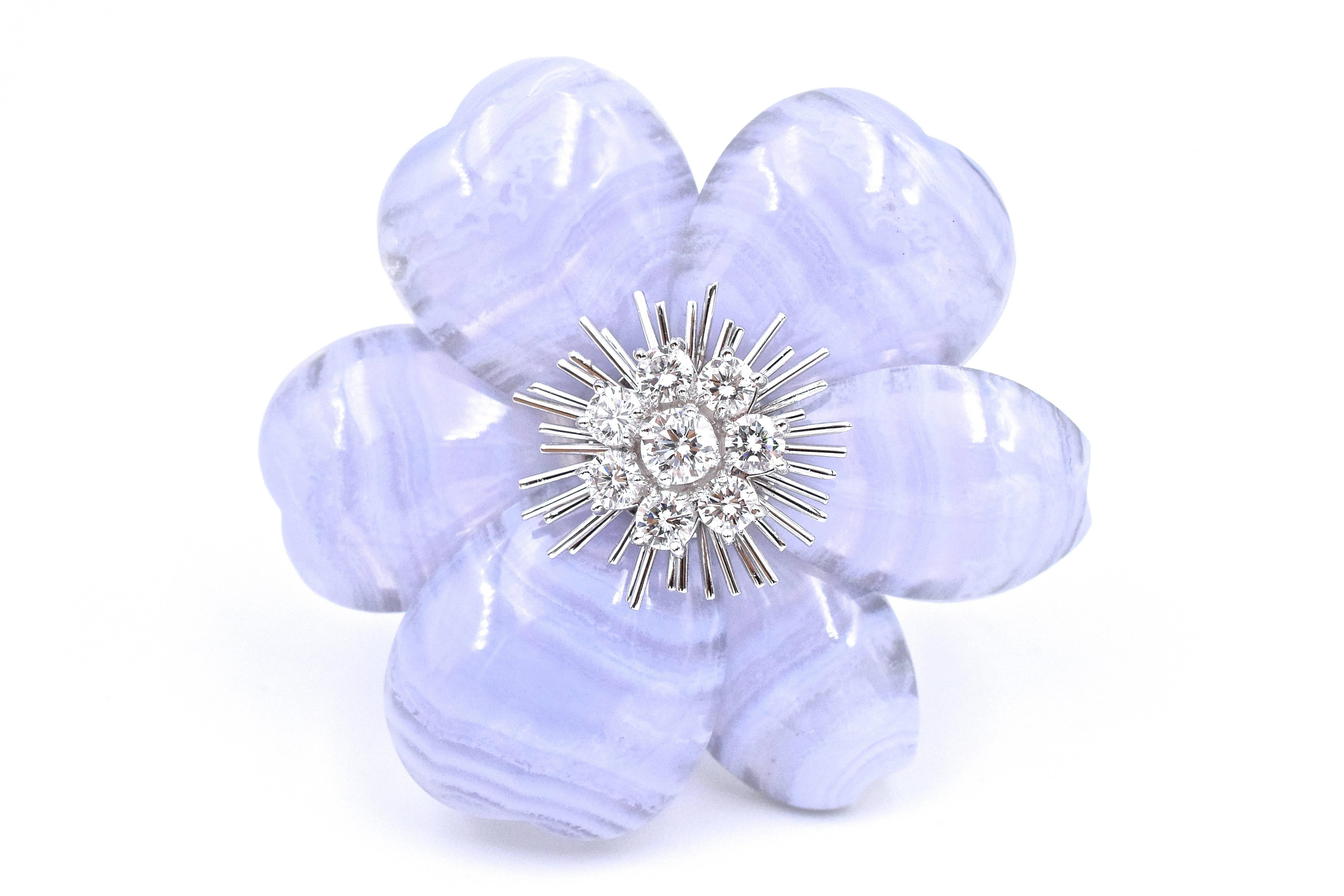 
Van Cleef and Arpels  chalcedony and diamond brooch/necklace.
 The brooch has 8 round diamonds forming a center cluster with 6 