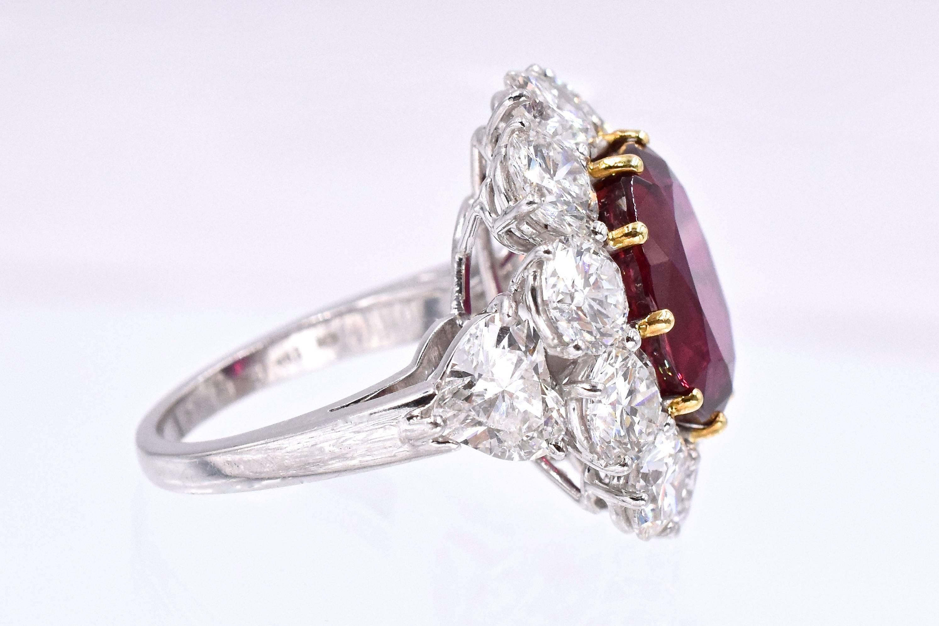 GRAFF! Ruby and diamond ring.
Center  is oval shape ruby with  weighing 9.44 carats, 
Within a frame of 10 round brilliant-cut diamonds and highlighted with two  heart-shaped diamonds on the shoulders. 
Total weight of diamonds approximately