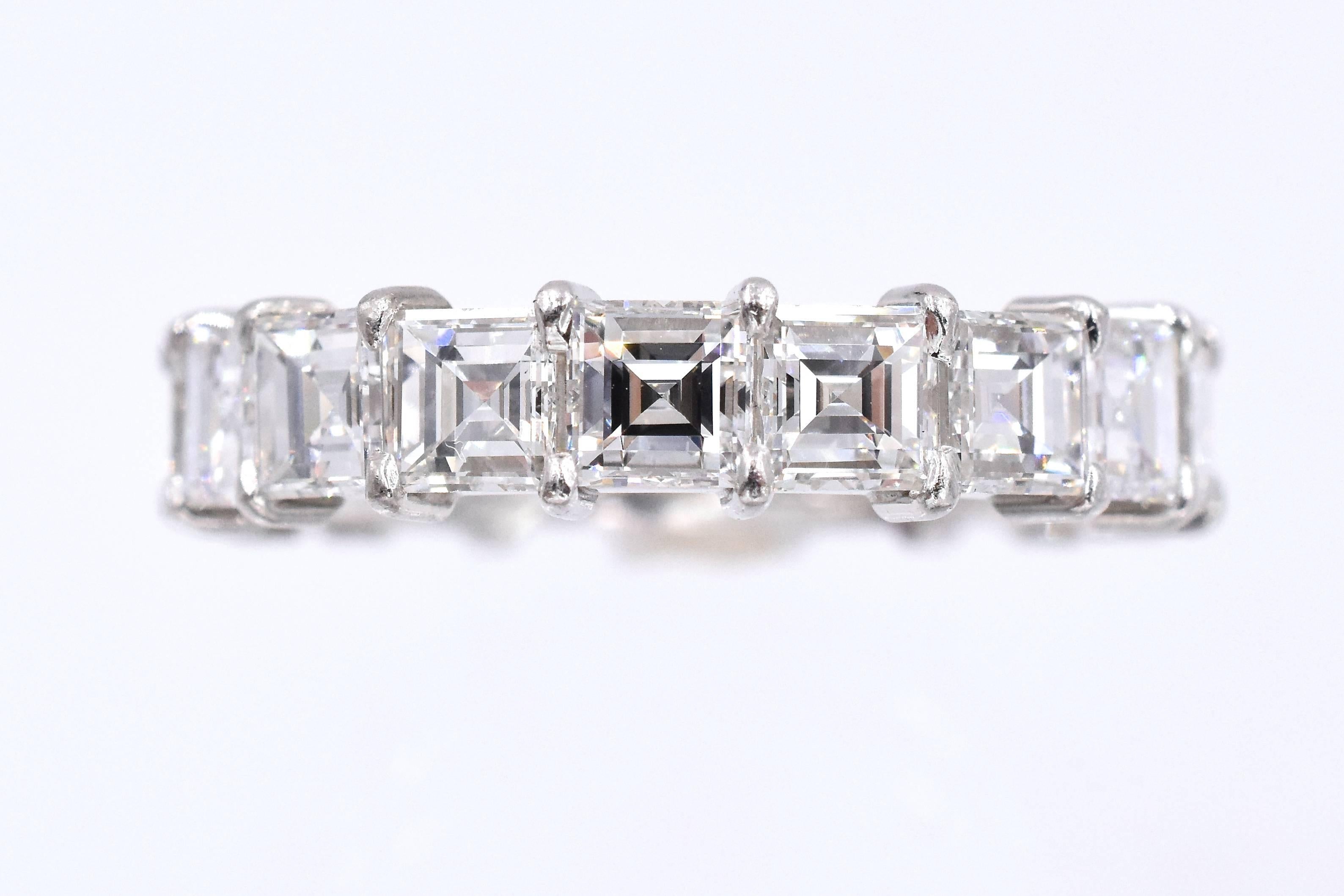 Beautiful 18 square shape diamonds set in platinum with common prong style.
Each diamond is 0.29 carat with total weight of 5.25 carat
Diamonds are E/F color and VS clarity
 Ring size is 5.3/4  
 Width is 5mm