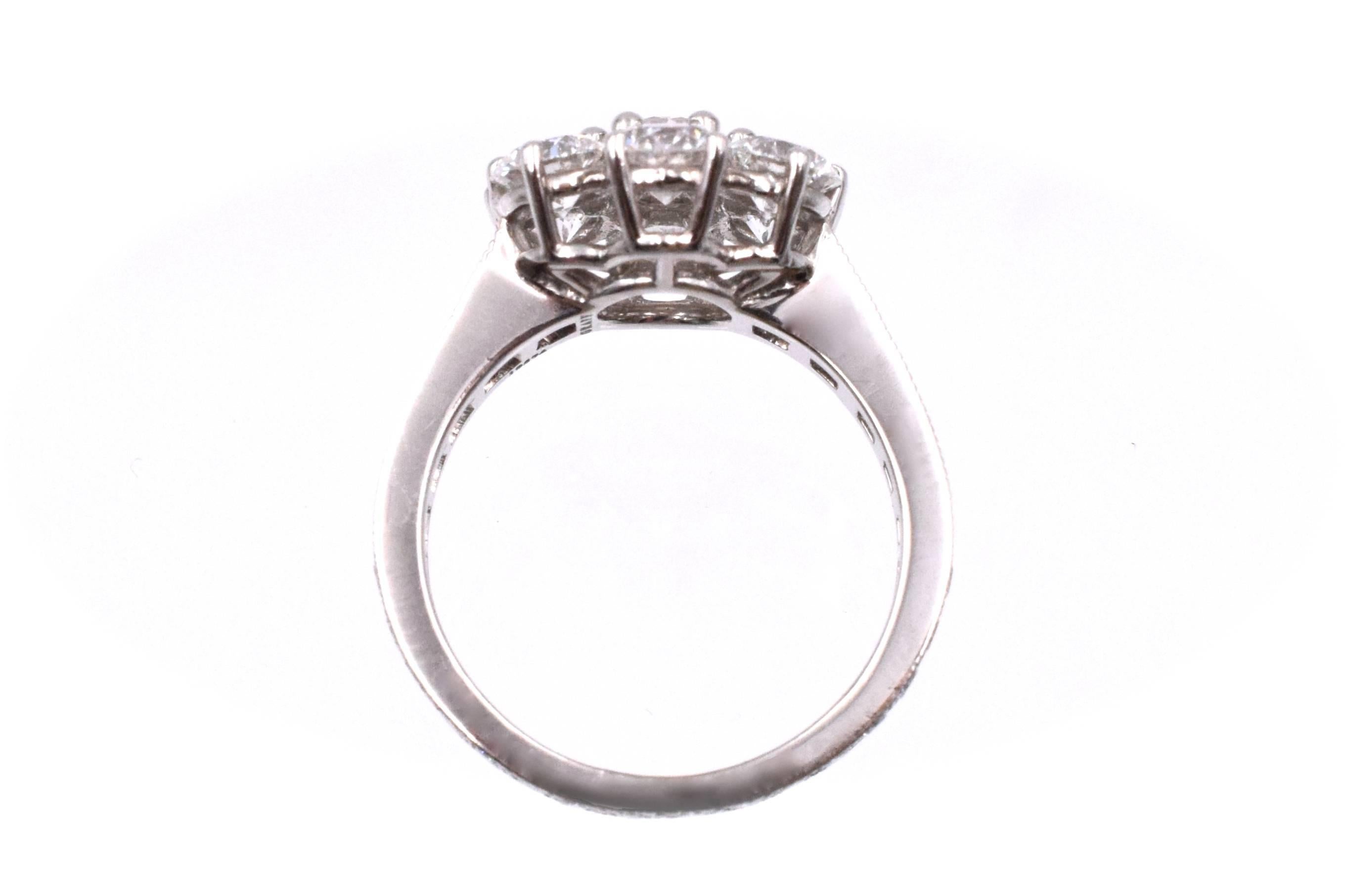Graff Flower style diamond ring with large brilliant diamonds in a flower design and 22 brilliant cut diamonds in the shank with a total carat weight of 3.85ct 
 Color: D-F Clarity: VVS-VS. 
Ring size:  6.5

Signed: GRAFF, numbered 19574. 
With