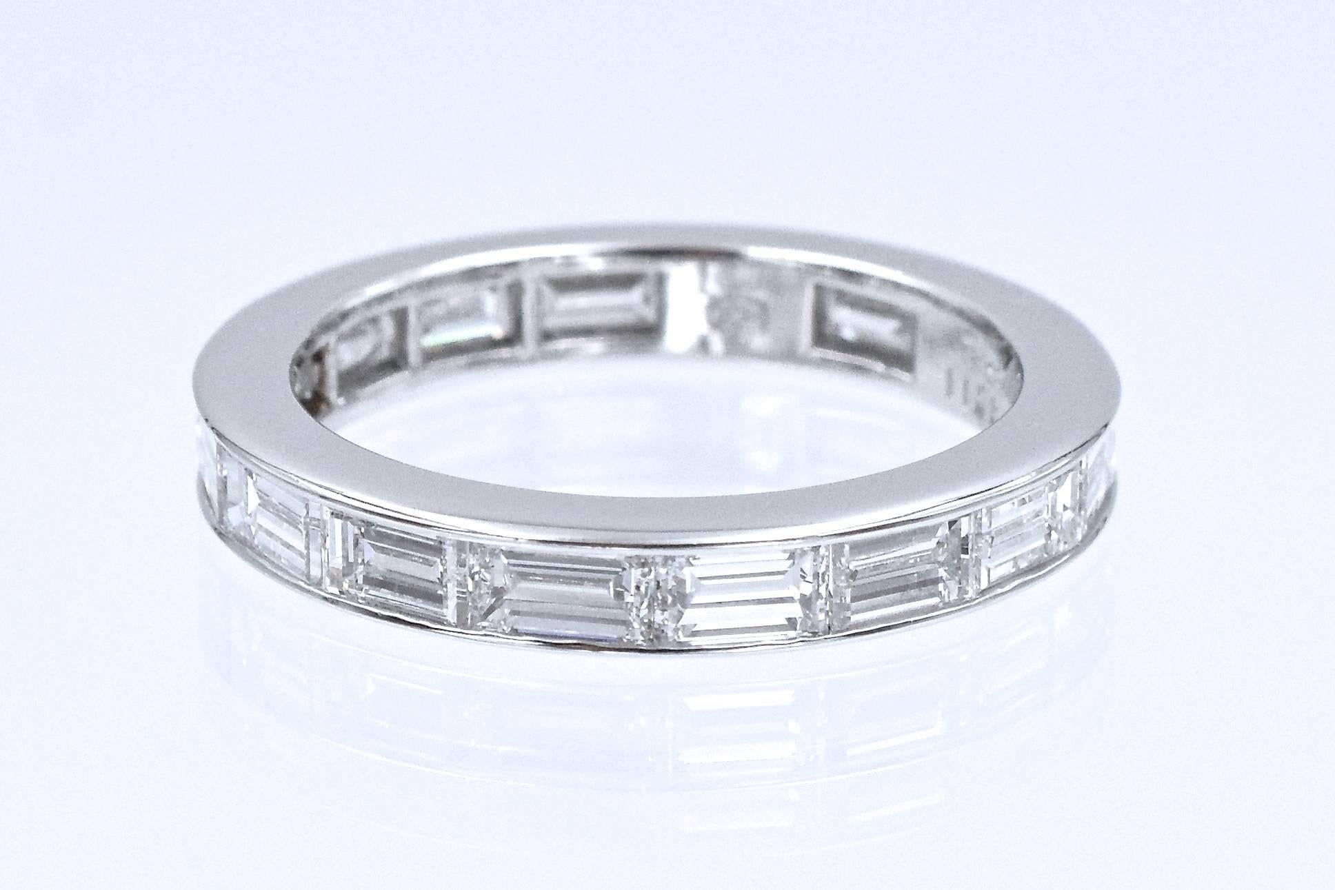 Elegant & Timeless diamond eternity band by Harry Winston.

This band has 16 emerald cut diamonds set in platinum with channel style
Total weight of the diamonds is 3 carats, F color VS clarity.
Signed HW, Stamped PT950, and numbered
Ring Size: 7.5