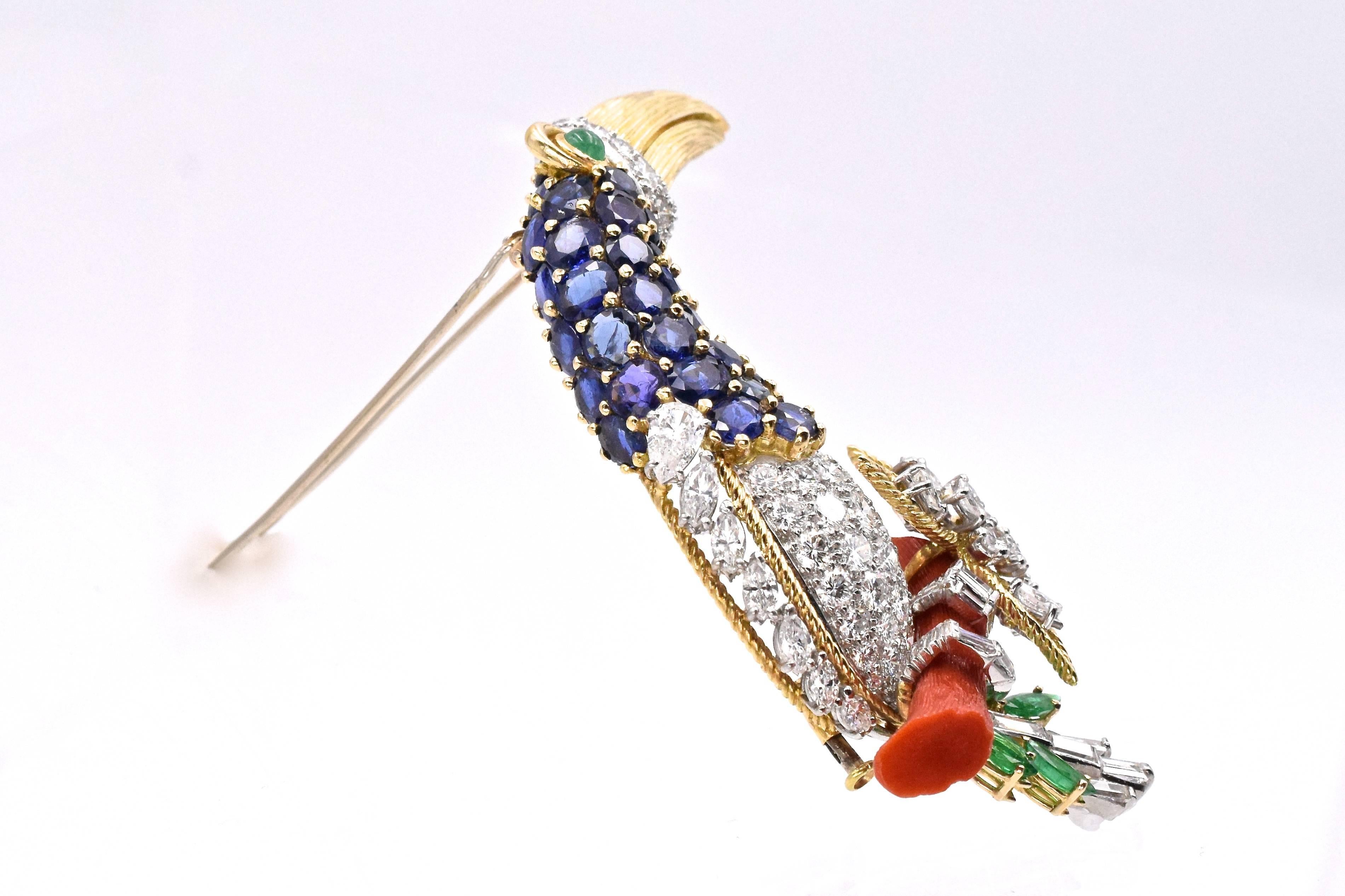  Branch Coral, Diamond and Gem-Set Toucan Clip-Brooch,  
 the stylized toucan perched atop a branch coral, with breast, wing, claws, tail and beak set with round, pear and marquise-shaped and baguette diamonds approximately 7.5ct., the neck is set