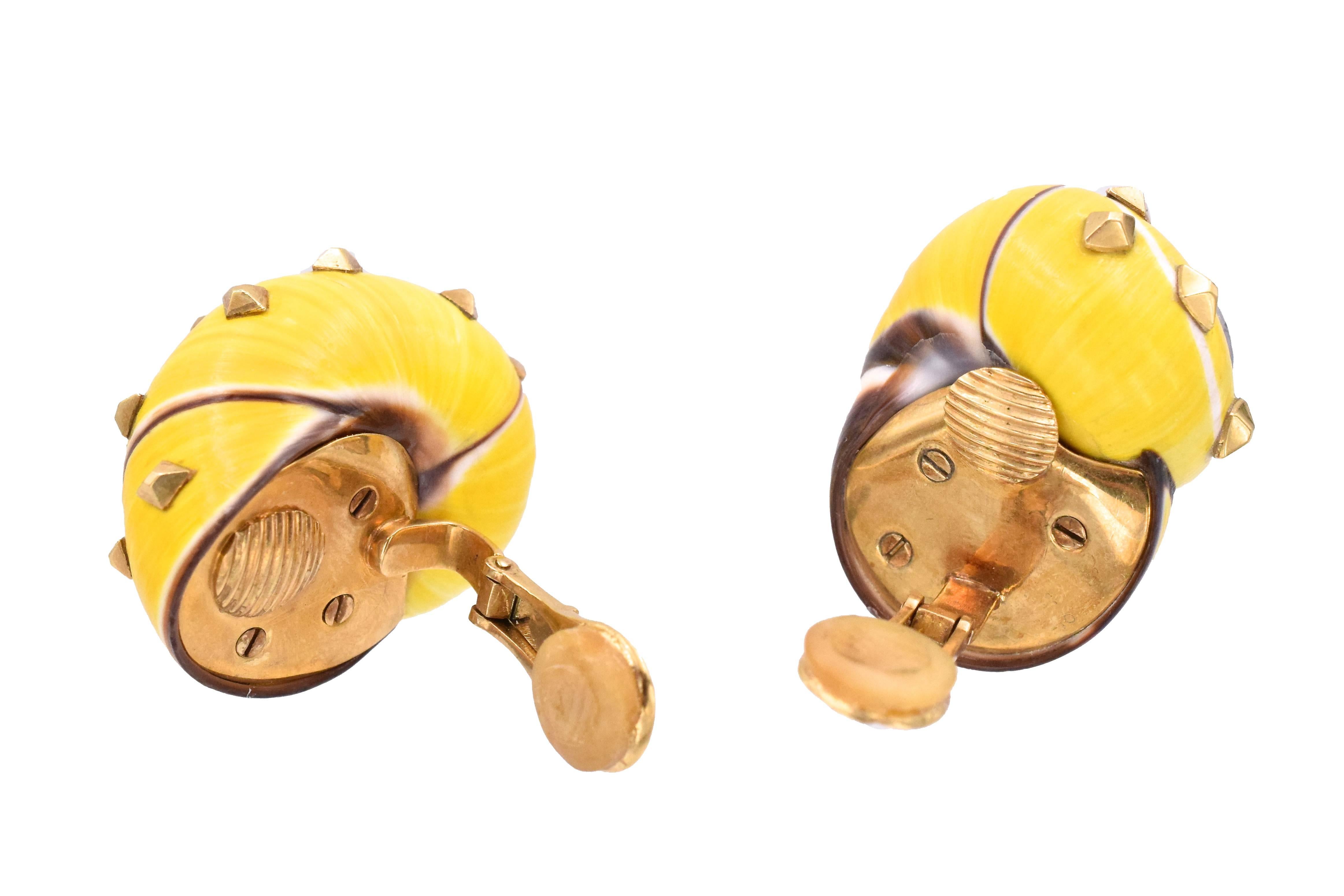 Vibrant yellow color shell  ear-clips by David Webb!
  With  gold spikes.
Measurements 30 by 22mm
Signed: David Webb