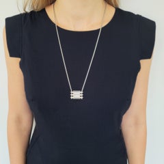 Van Cleef & Arpels Ebony wood and diamond watch pendant in 18k white gold.