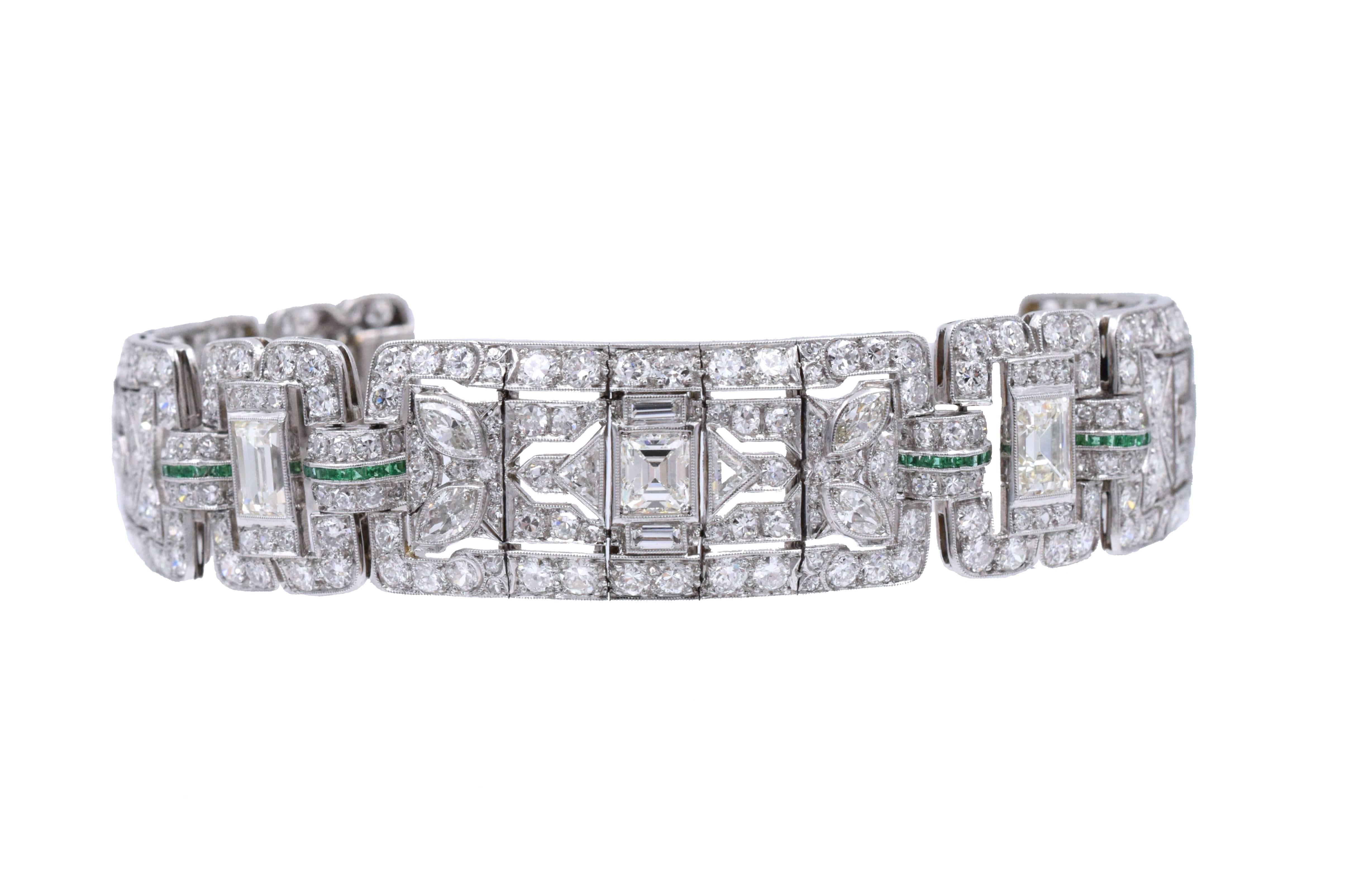 latinum, diamond and emerald bracelet,  Set with emerald cut diamonds weighing approximately 7carats and old european-cut, single-cut, baguette, marquise-shaped and triangular-shaped diamonds weighing a total of approximately 19 carats, accented by