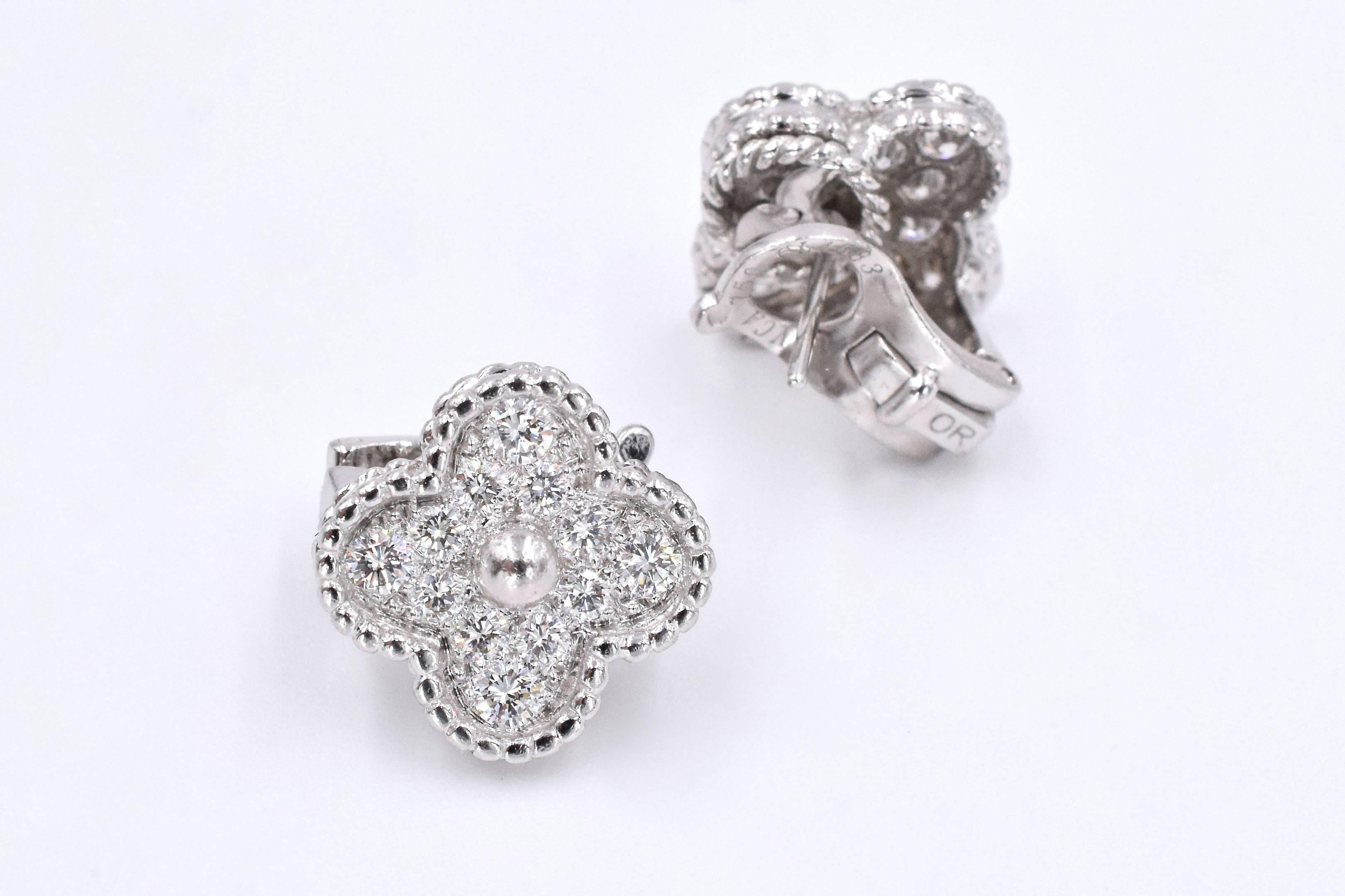 VCA Alhambra Earrings. This pair of earrings has 24 diamonds with a total carat weight of approximately 1ct set in 18k white gold.
 Signed VCA, stamped 750, and numbered