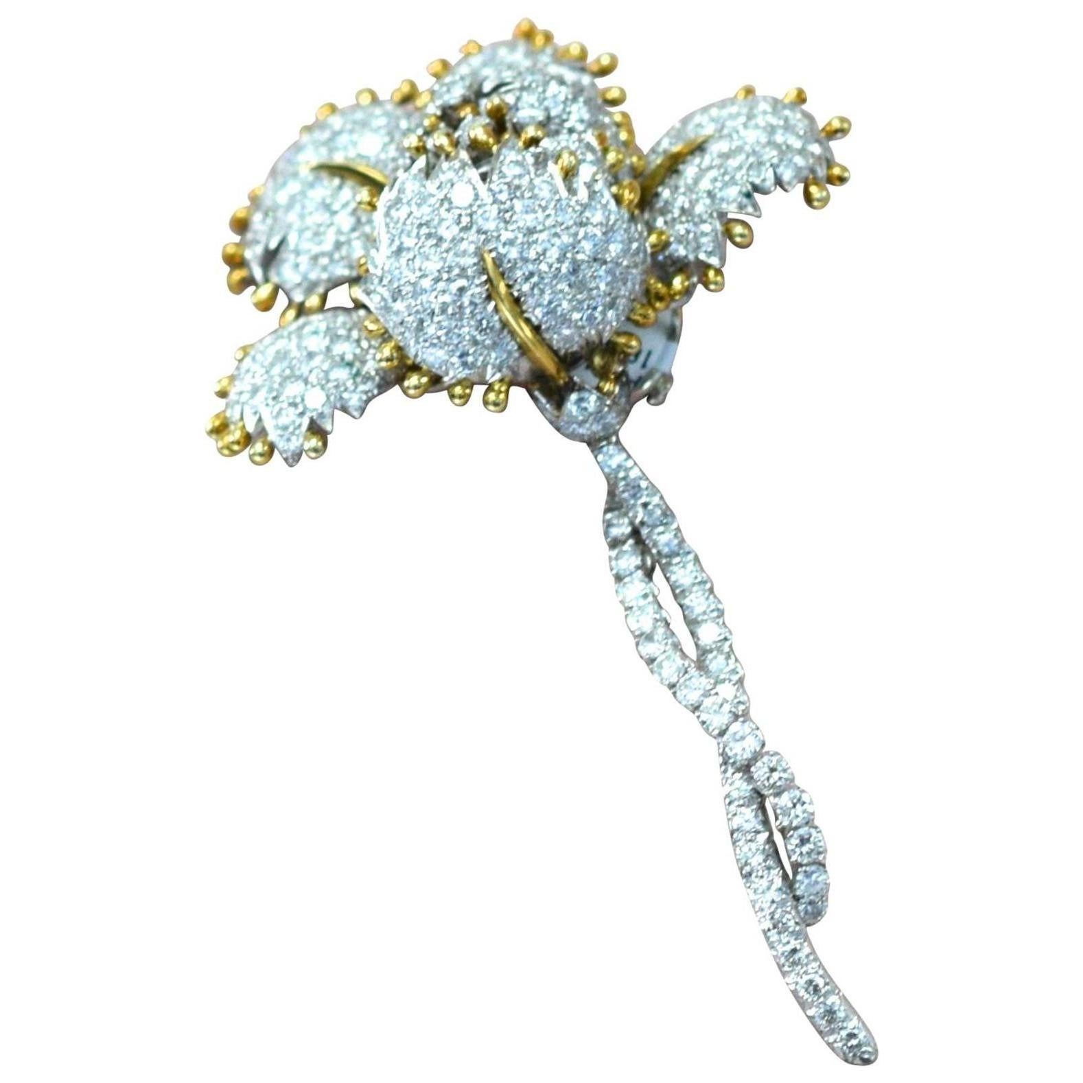 A diamond brooch, Van Cleef & Arpels of floral design, set throughout with round brilliant-cut diamonds, estimated total diamond weight is approximately 19-20 carats; mounted in platinum and 18k gold
 Length: 3 1/2in. 
Signed VCA & numbered