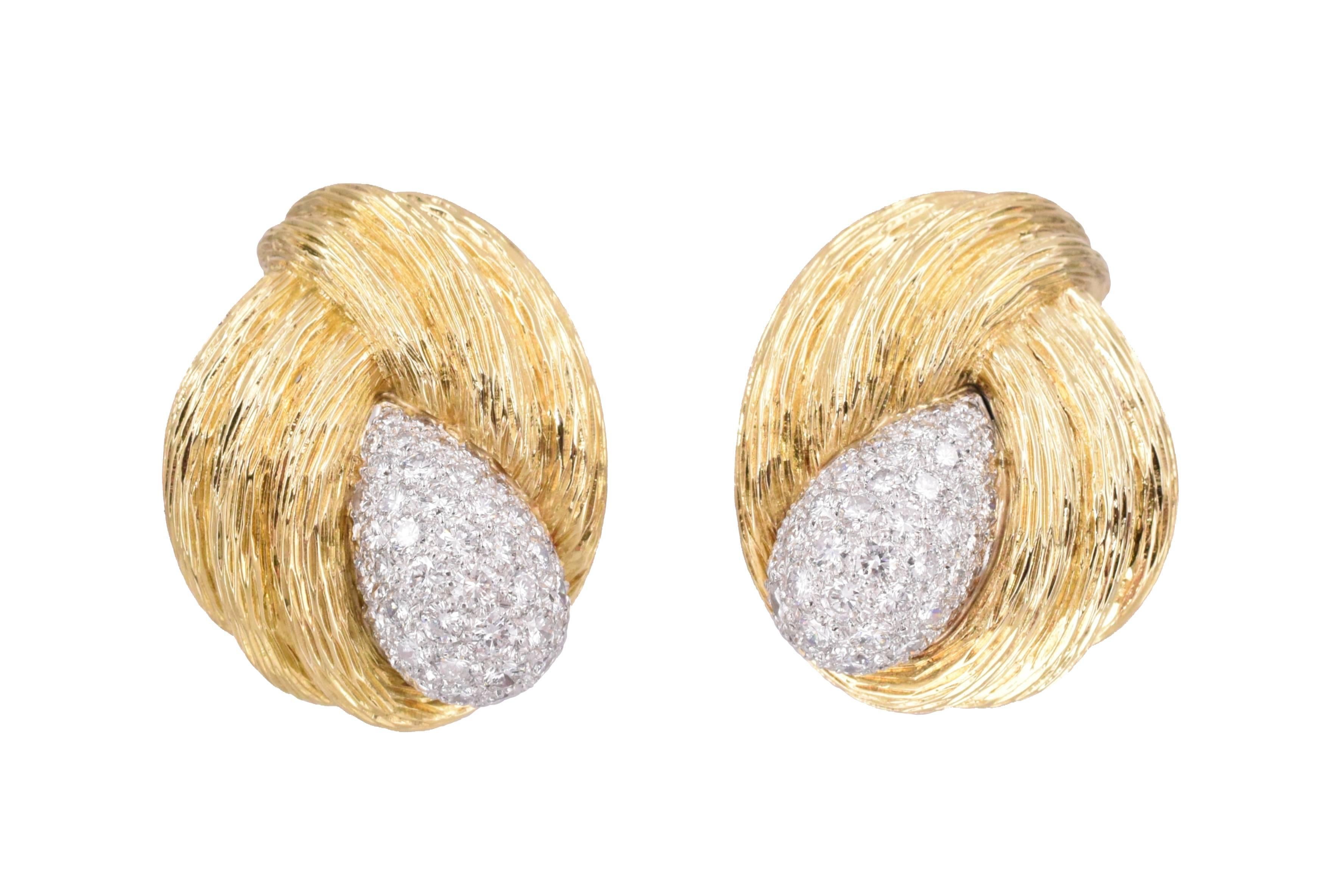 Timeless ear clips by Van Cleef and Arpels!
Sculpted fluted yellow gold design surrounding domed white gold centers pave set 100  top quality brilliant diamonds.
Estimated total weight of the diamonds is 5.25 
Stamp: Van Cleef and Arpels and 