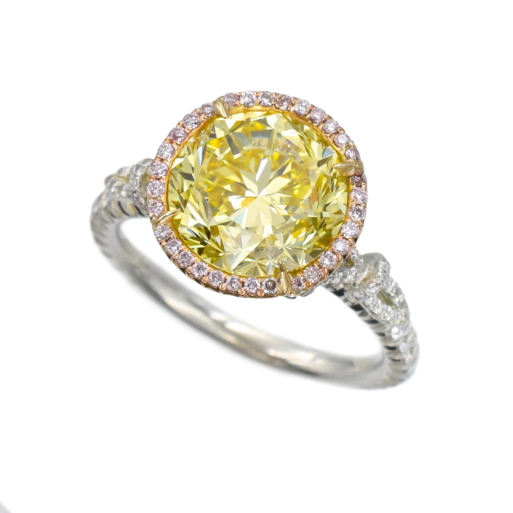 NALLY Vivid Intense Yellow color diamond ring with 3.76 carat center diamond GIA # xxxxxxx
Color Fancy Vivid Yellow,  Clarity- VS1
This ring has 74 round brilliant cut diamonds 0.53 carats set in platinum with 81 pink color round brilliant cut