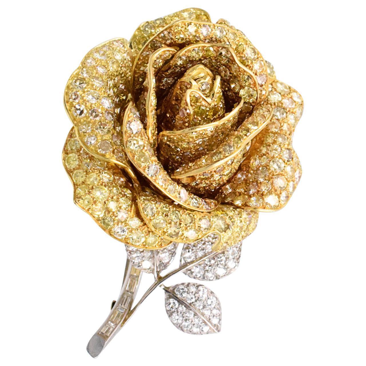 Impressive yellow diamond rose brooch!
Rose petals are in yellow gold encrusted with yellow diamonds, the stem and leaves are in platinum encrusted with brilliant and rectangular diamonds. Estimated diamond weight is 30 carats.
Measurements: 65mm x
