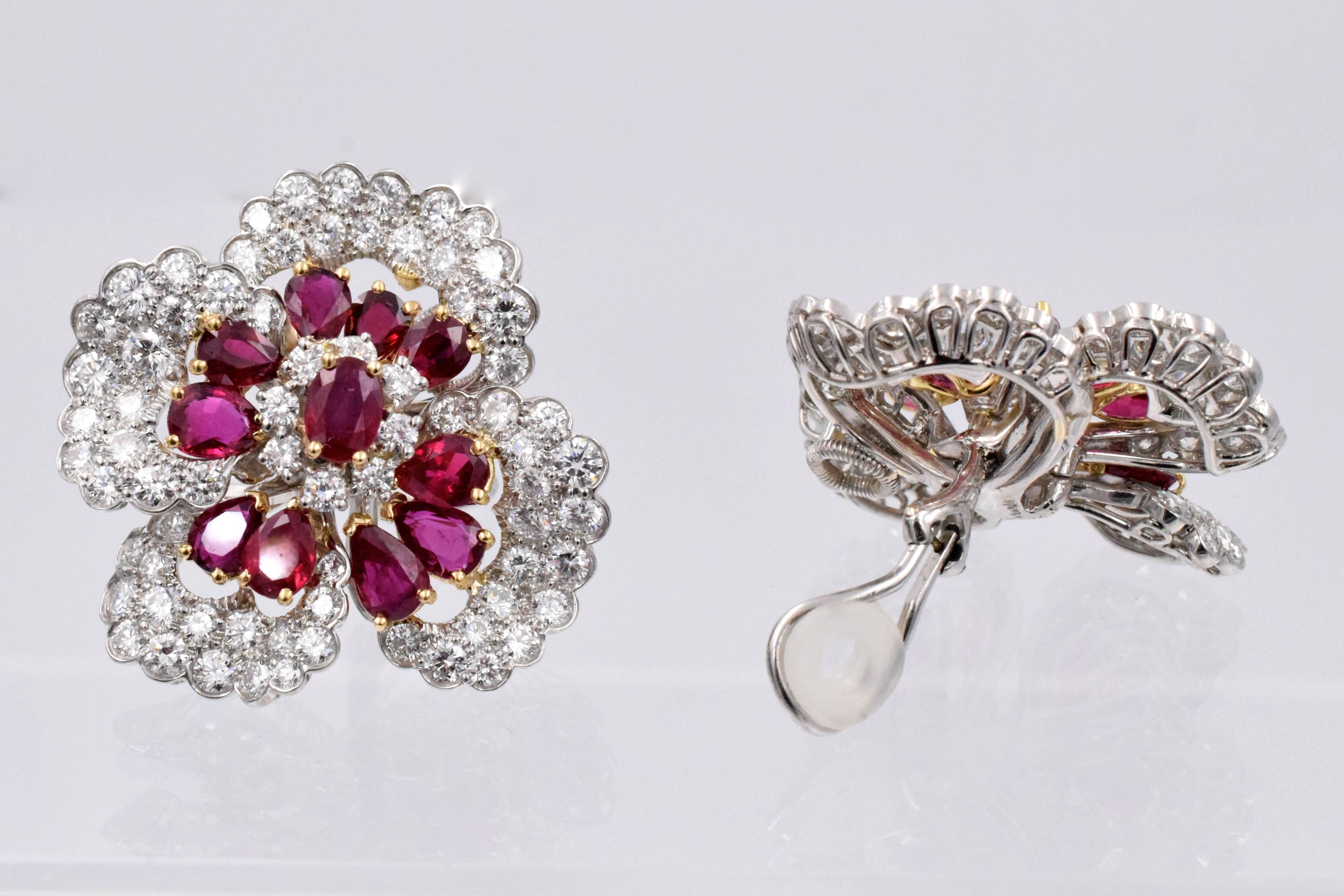 Impressive! vibrant red color pear and oval shape rubies surrounded with fine quality brilliant shape diamonds in a shape of a flower set in  platinum and 18k gold.
Estimated diamonds weight is 17 carats
Estimated rubies weight is:    8