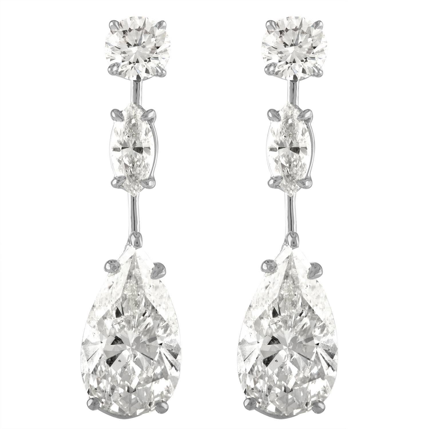 5.02 Carat Pear Shape & 5.23 Carat Pear Shape Earrings Set in Platinum Mounting