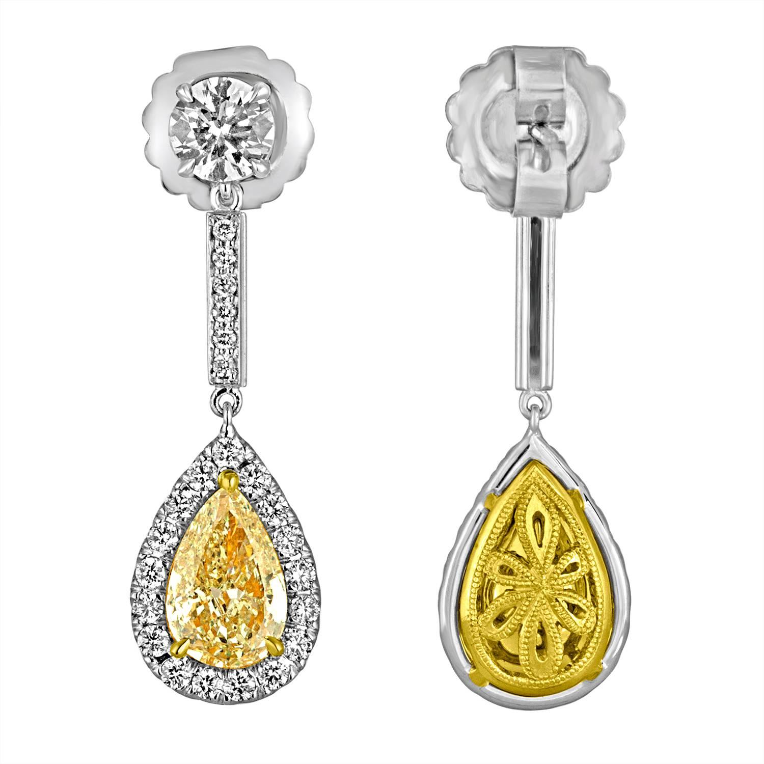 A pair of Simple, Beautiful and yet very Classic Pear Shape Earrings. Two Pear Shapes, 4.03 Carat Total Weight of Yellow Pear Shape Diamonds are set in Two Tone Mounting, 18K Yellow Gold and 18K White Gold with a pair of Brilliant Diamonds on top,